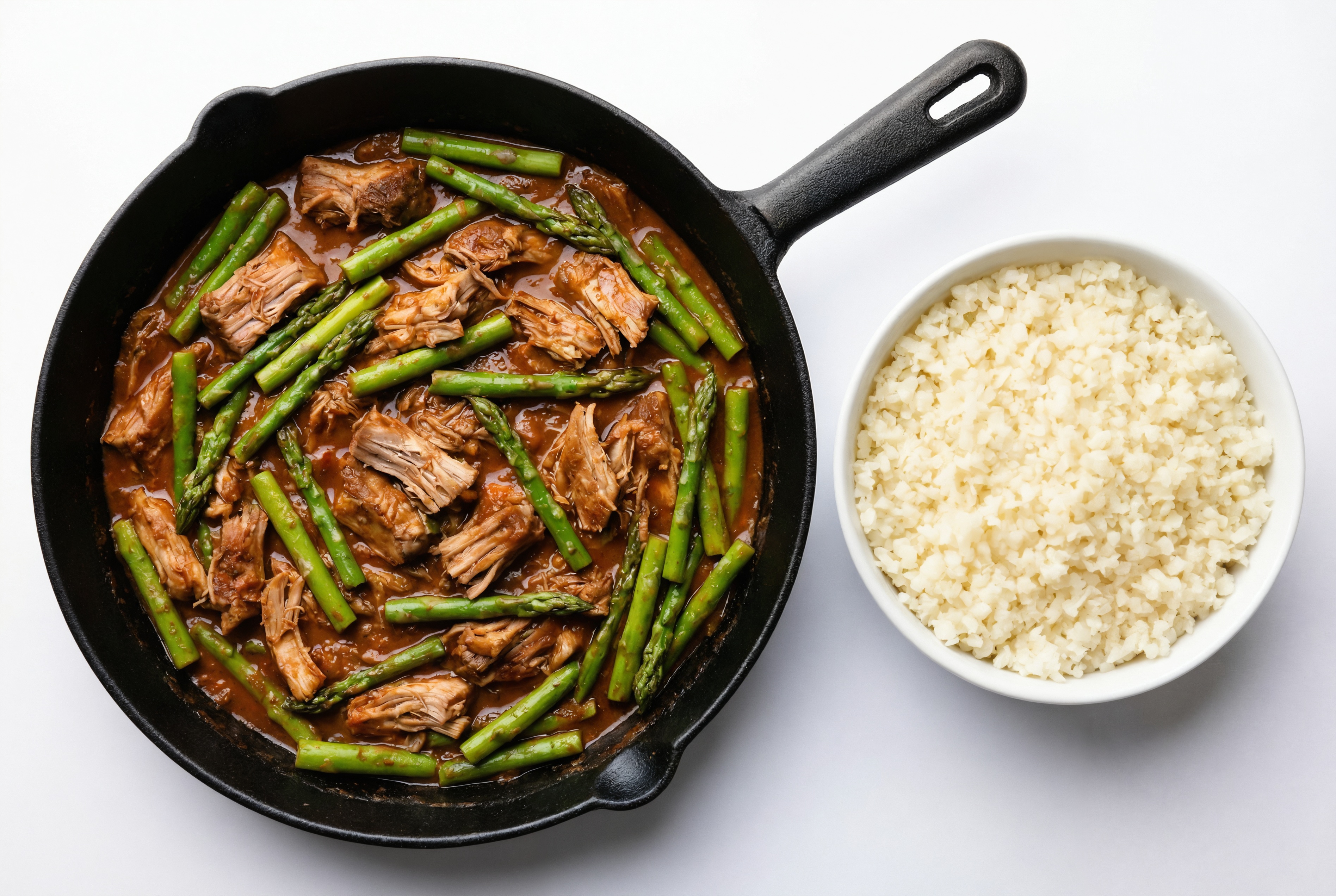 Spicy Vindaloo Pork Stir-Fry with Asparagus over Riced Cauliflower