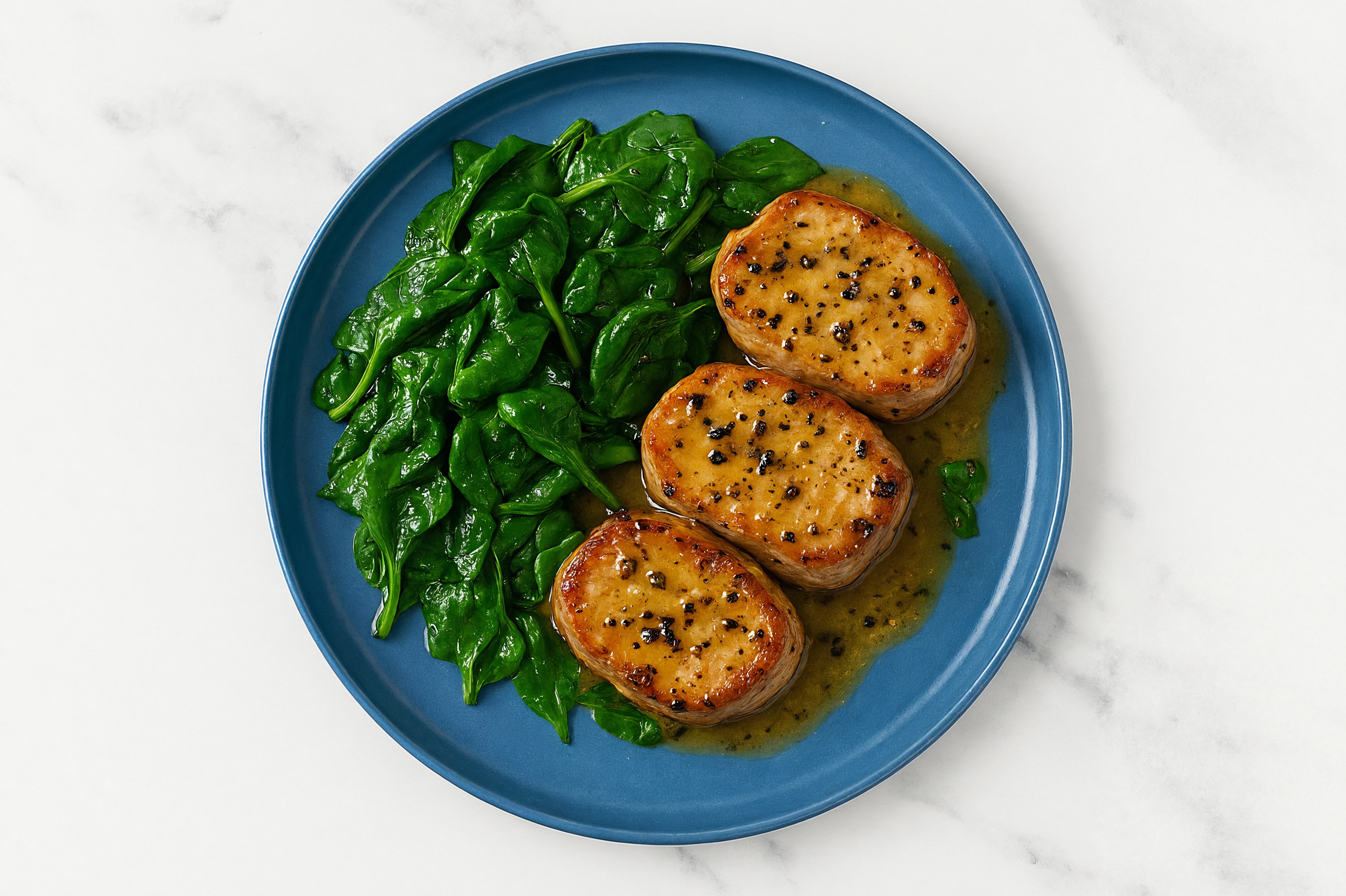 Buttery Slow Churned Lemon & Peppercorn Pasture Butter Pepper Pork Medallions + Sautéed Baby Spinach