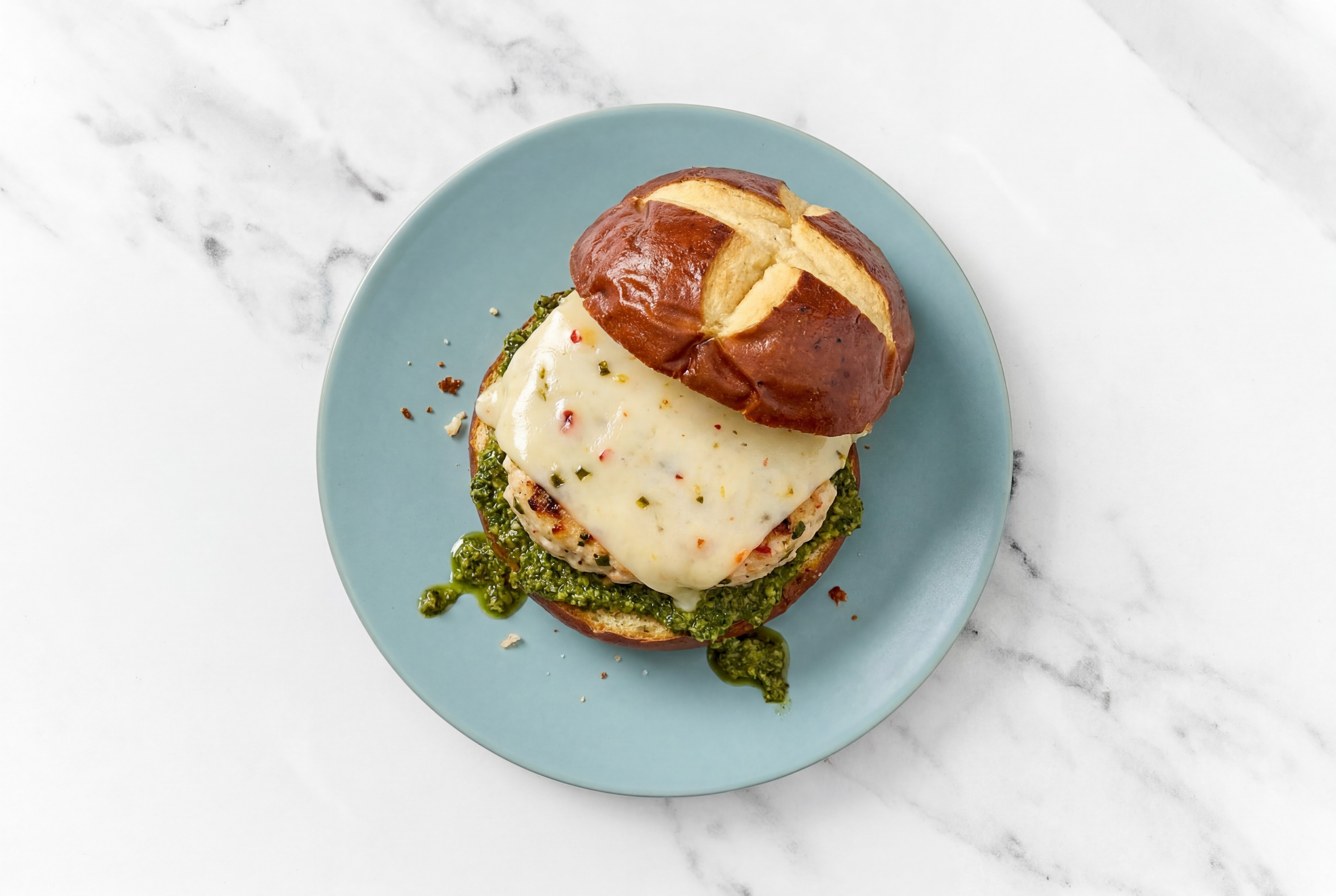 Garlic Chicken Burger on Pretzel with Spinach Pesto & Pepper Jack