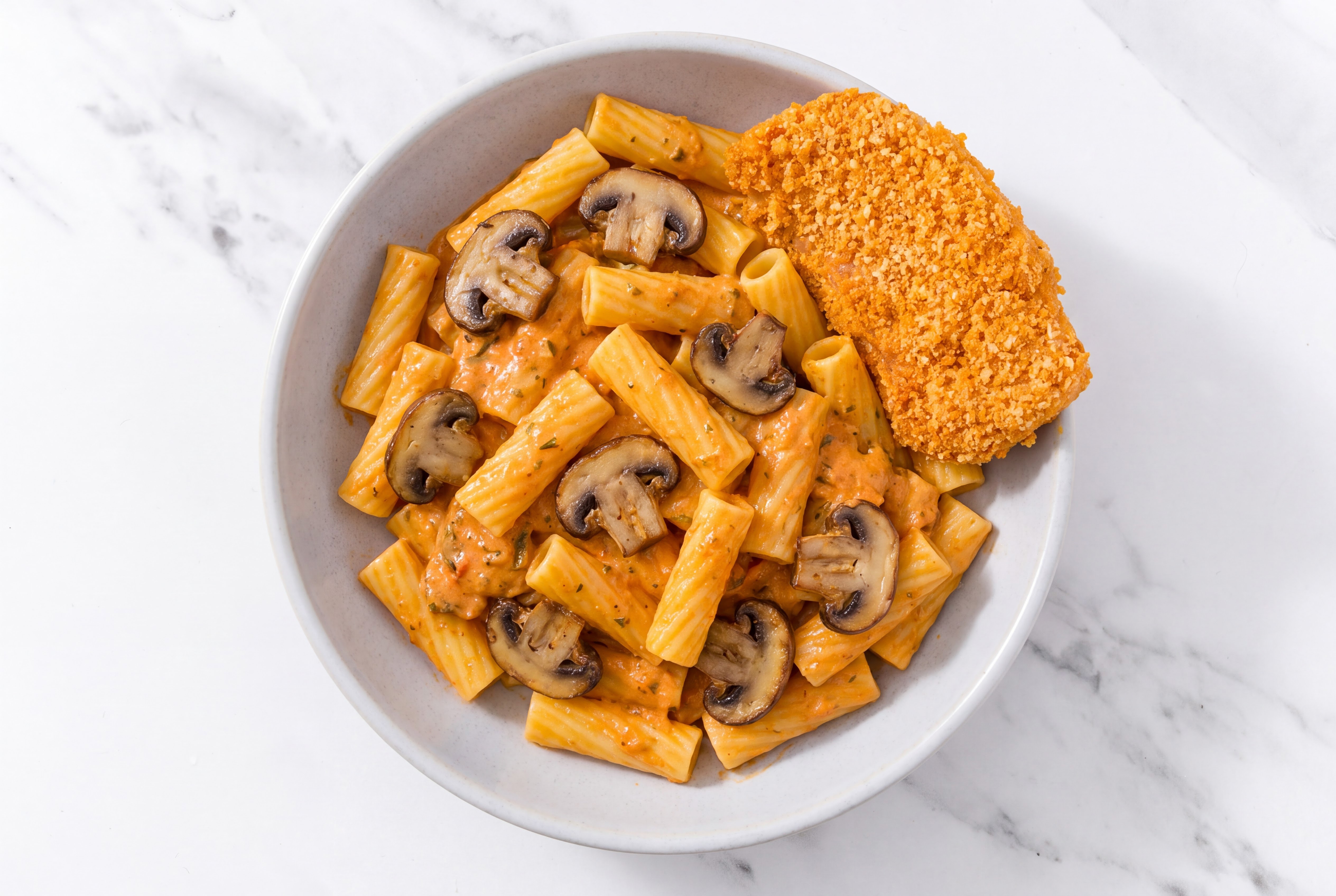 Crispy Hot Honey Chicken over Creamy Vodka Rigatoni with Baby Bella Mushrooms