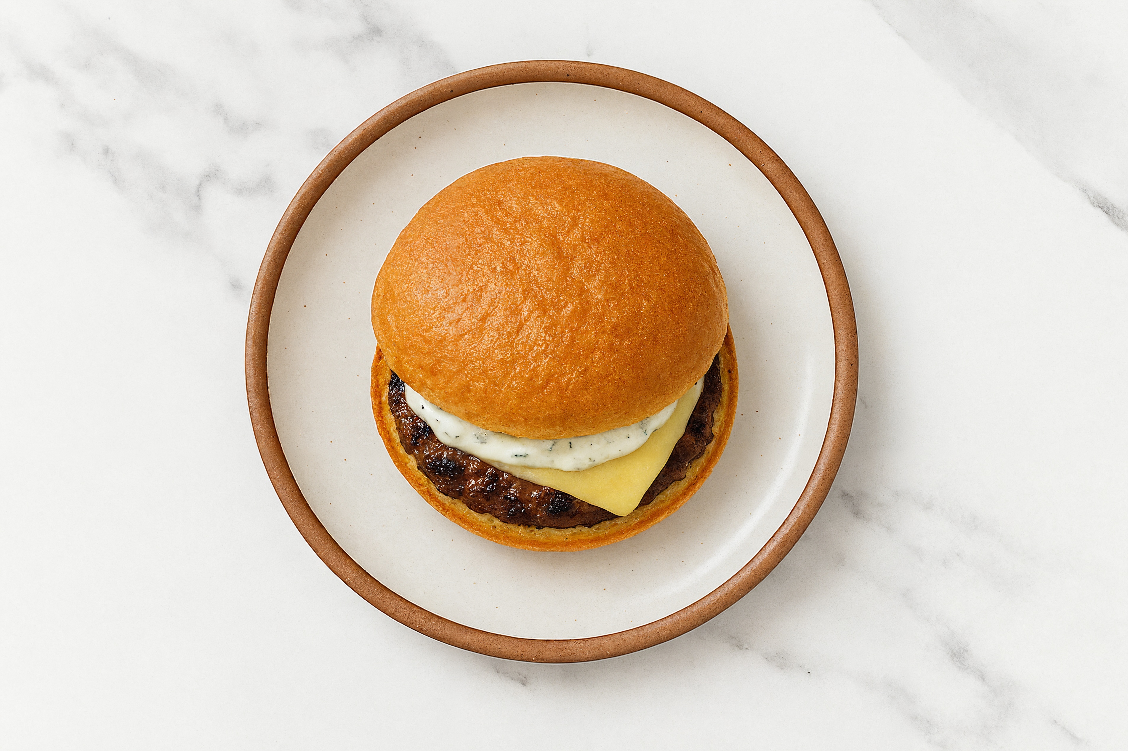 Ground Lamb Burger on Gluten-Free Bun with Tzatziki & Havarti