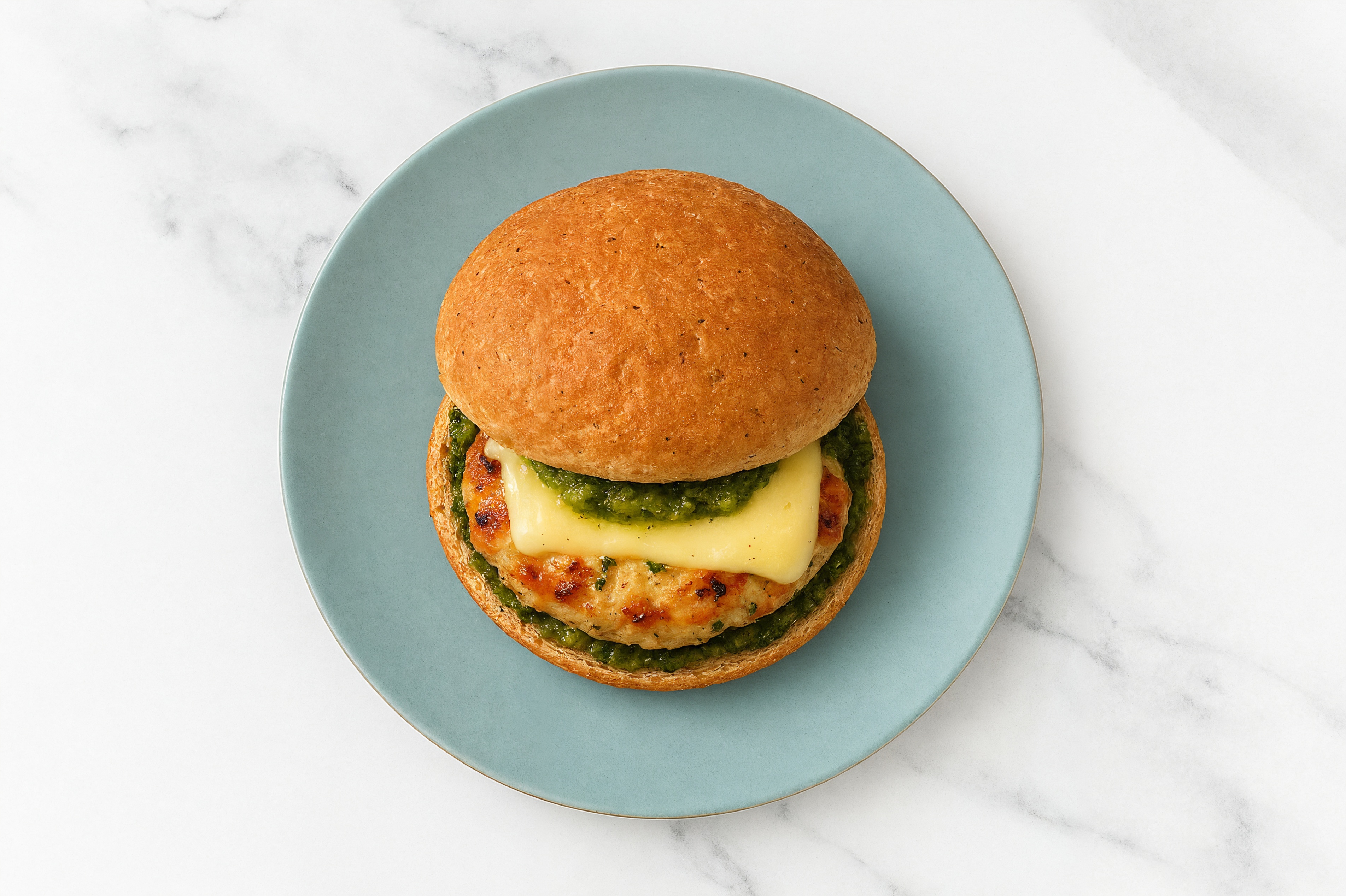 Garlic Chicken Burger on Sprouted Grain with Spinach Pesto & Swiss