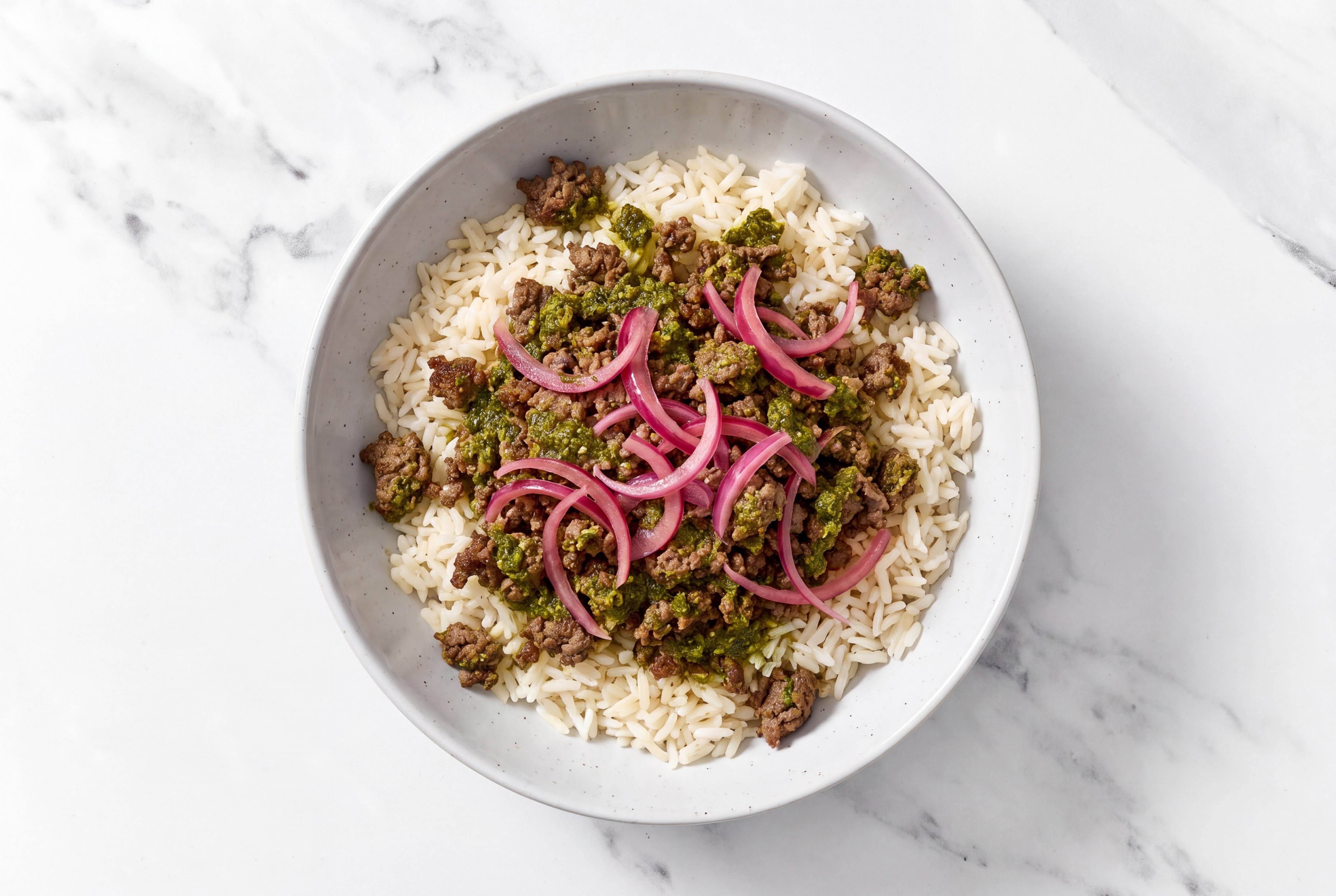 Beef + Zhoug Rice Bowl with Pickled Onions