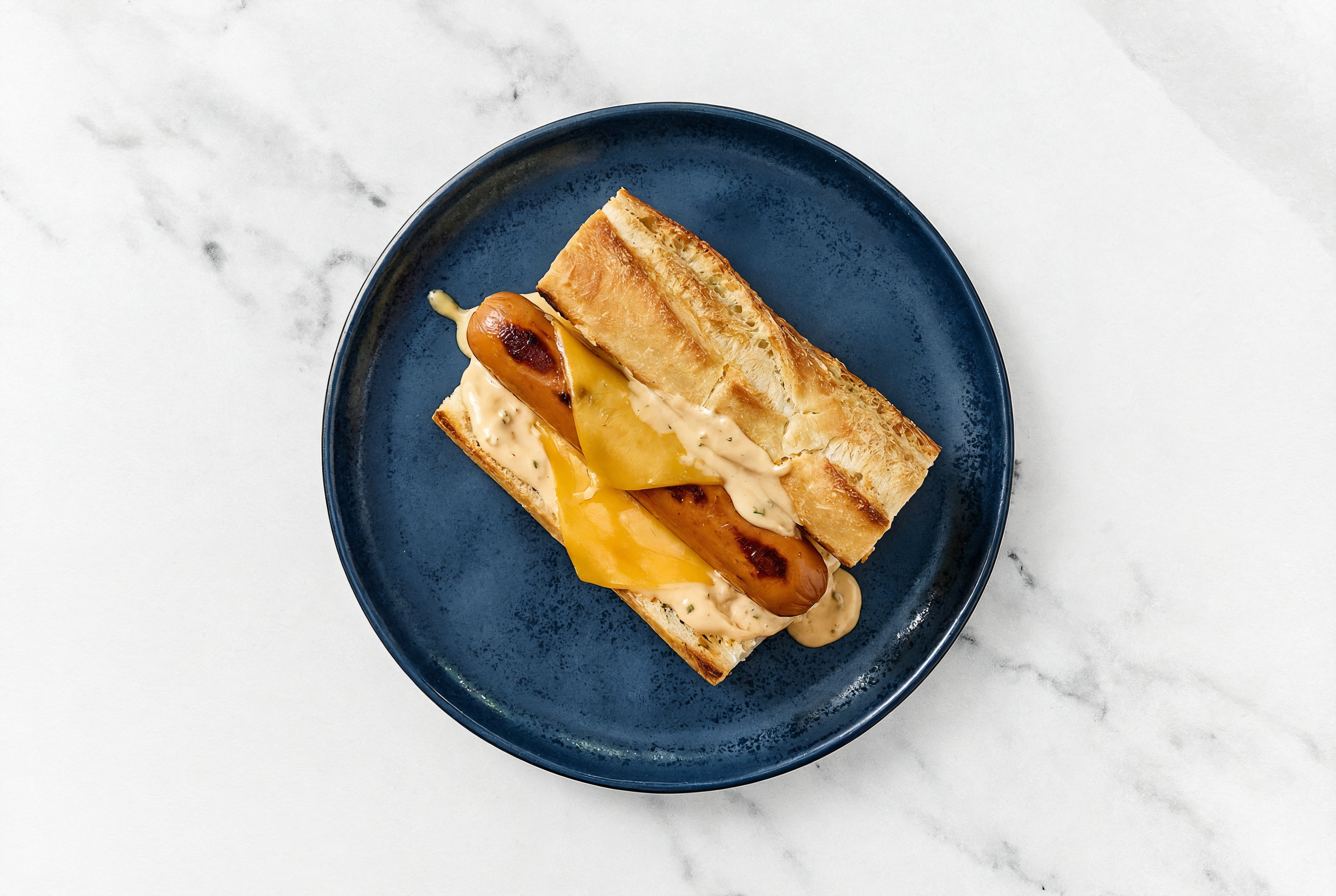 Cheddar Smart Dog with Awesome Sauce on Baguette