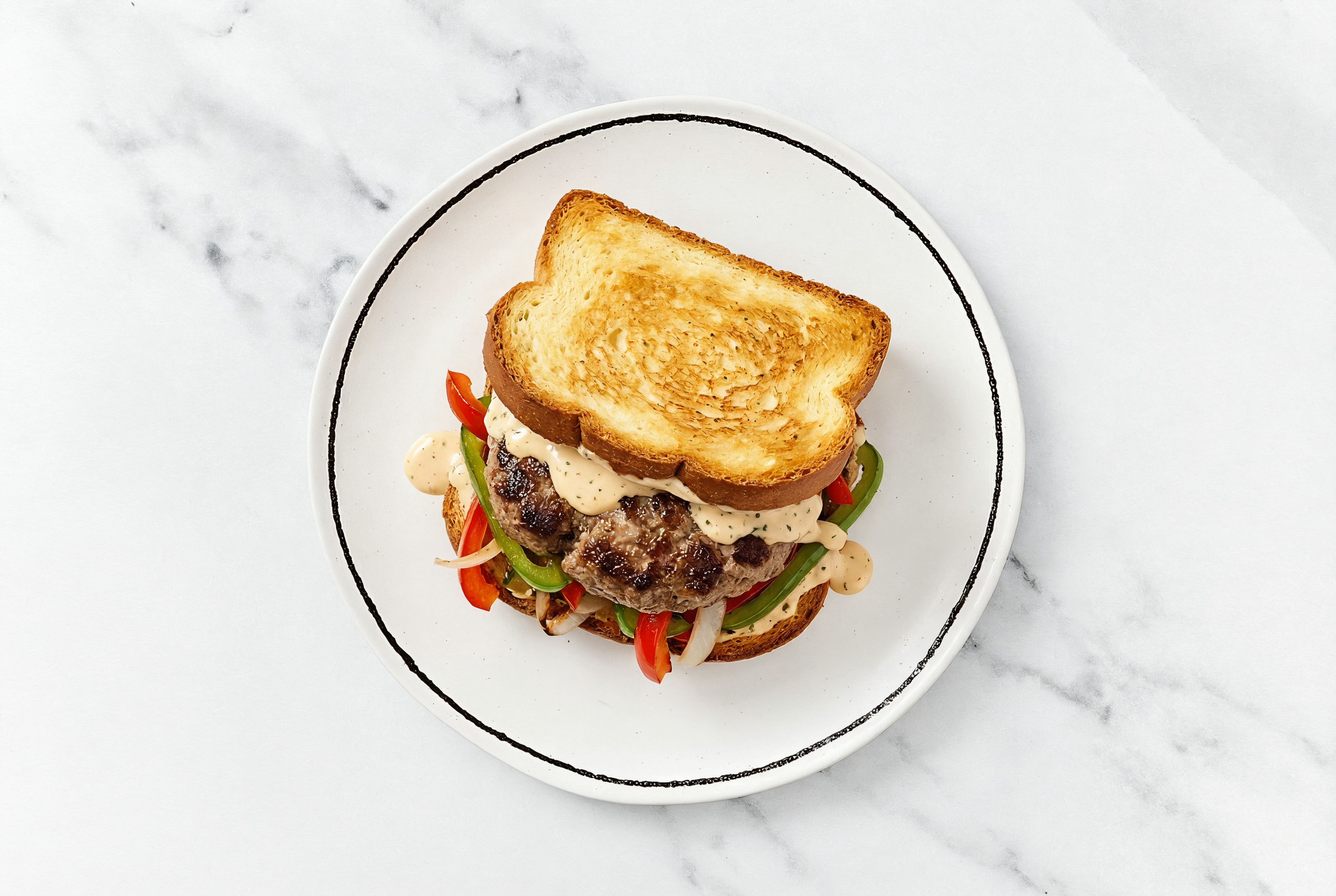 Onion + Pepper Wagyu Beef Burger on GF Bread with Buffalo Ranch