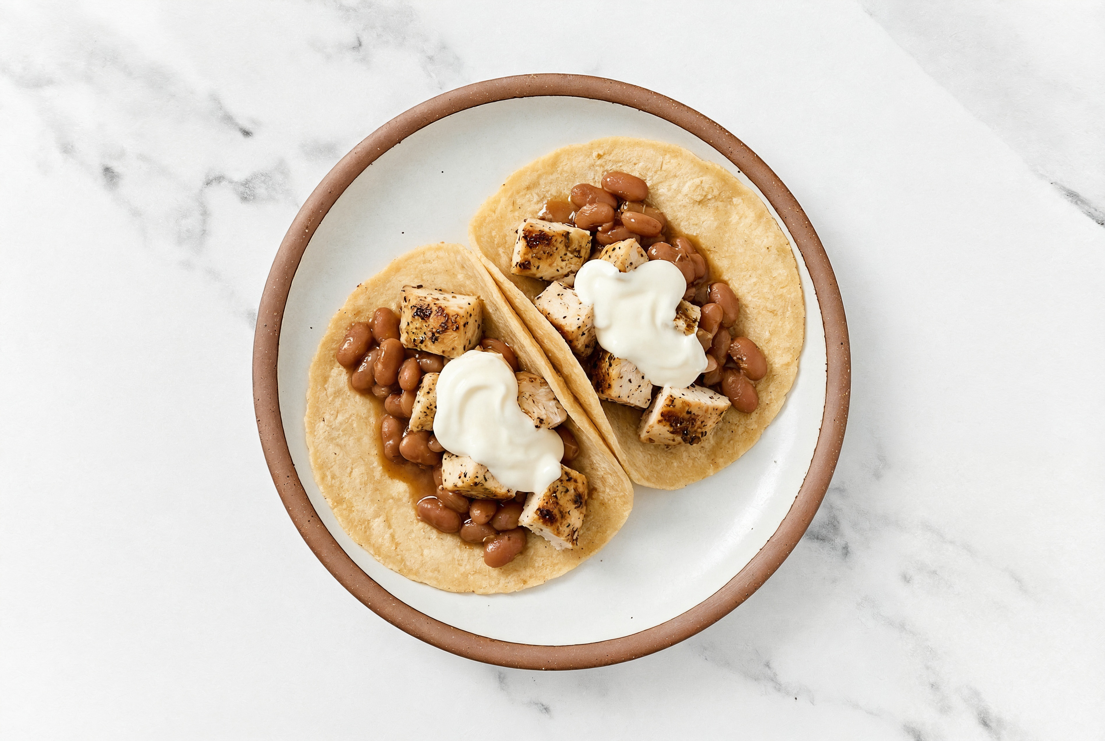 Garlic Chicken Tacos with Crema & Pinto Beans