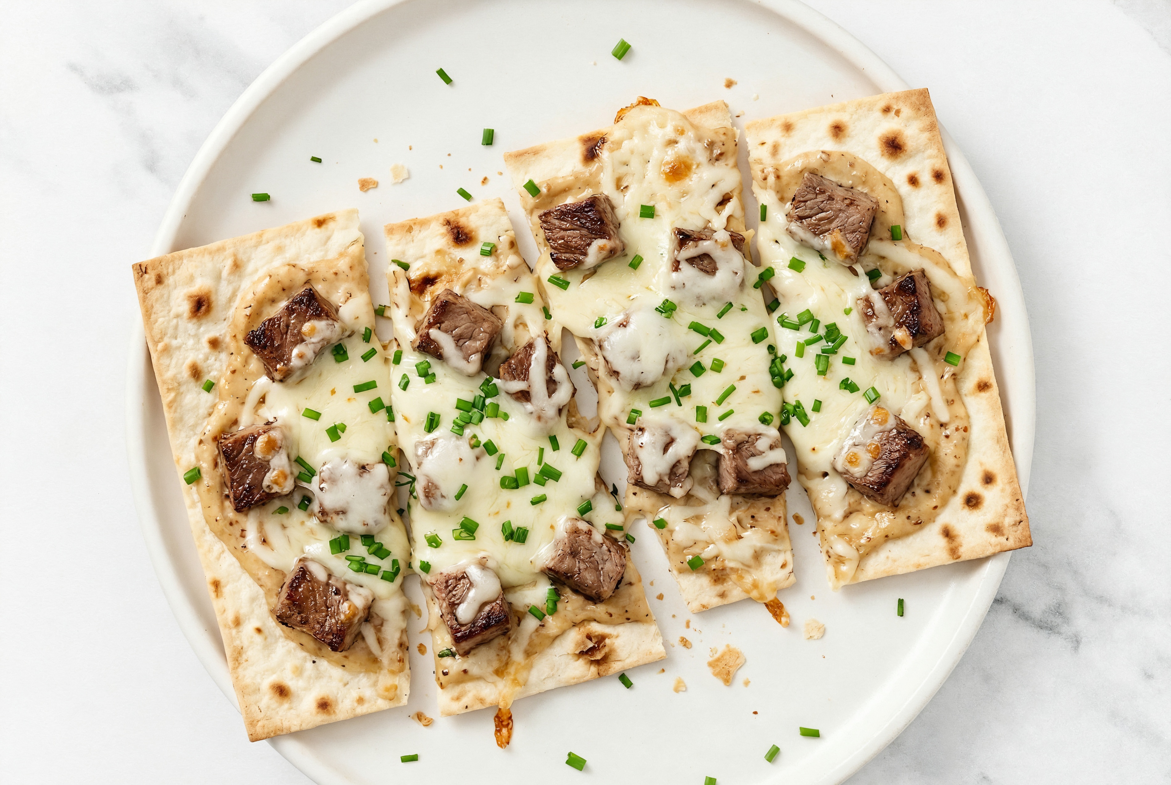 Sweet Onion Wagyu Filet Lavash Pizza with "Mozzarella" + Fresh Chives