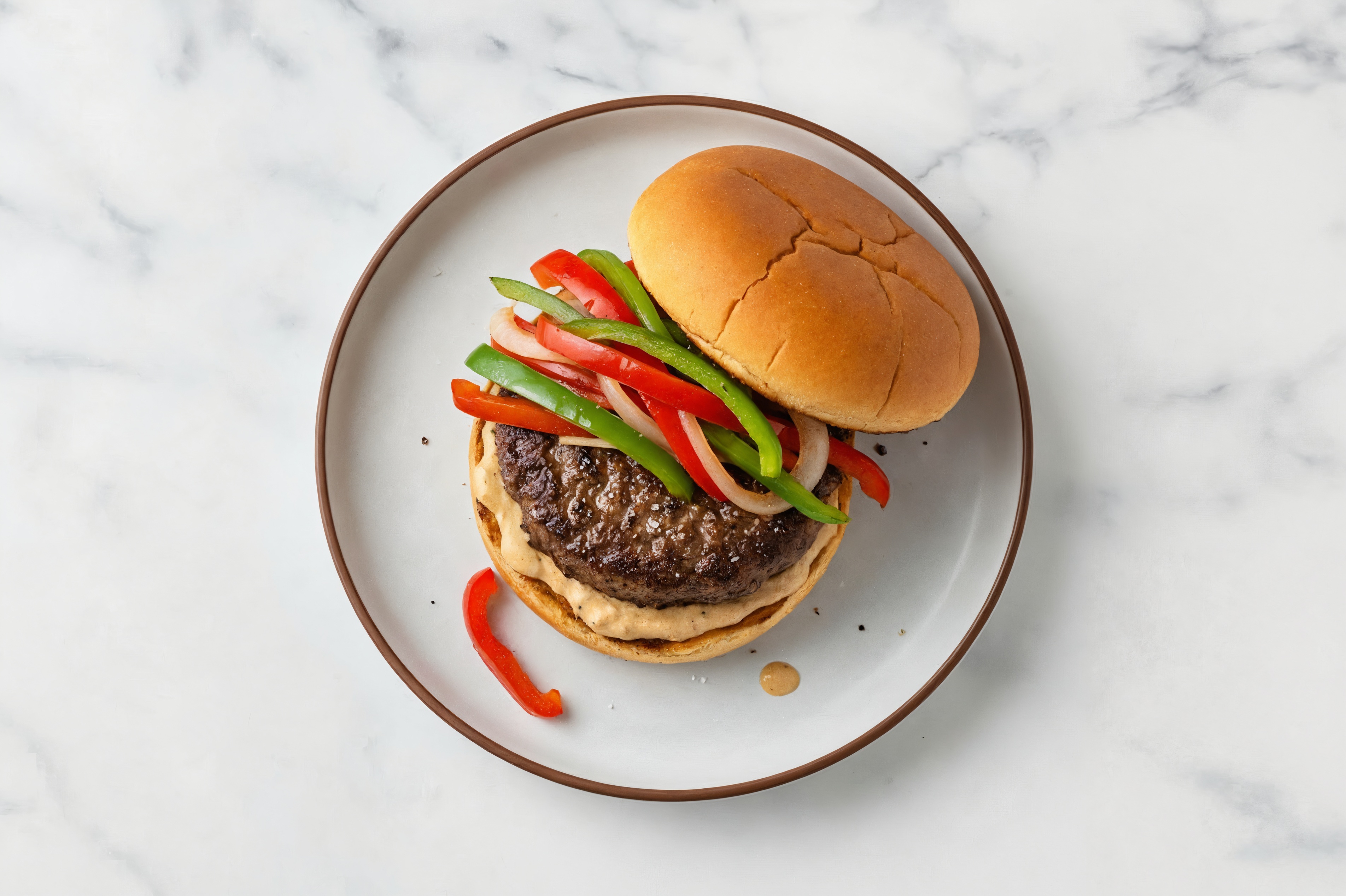 Onion + Pepper Wagyu Beef Burger on GF Bun with French Onion Sauce
