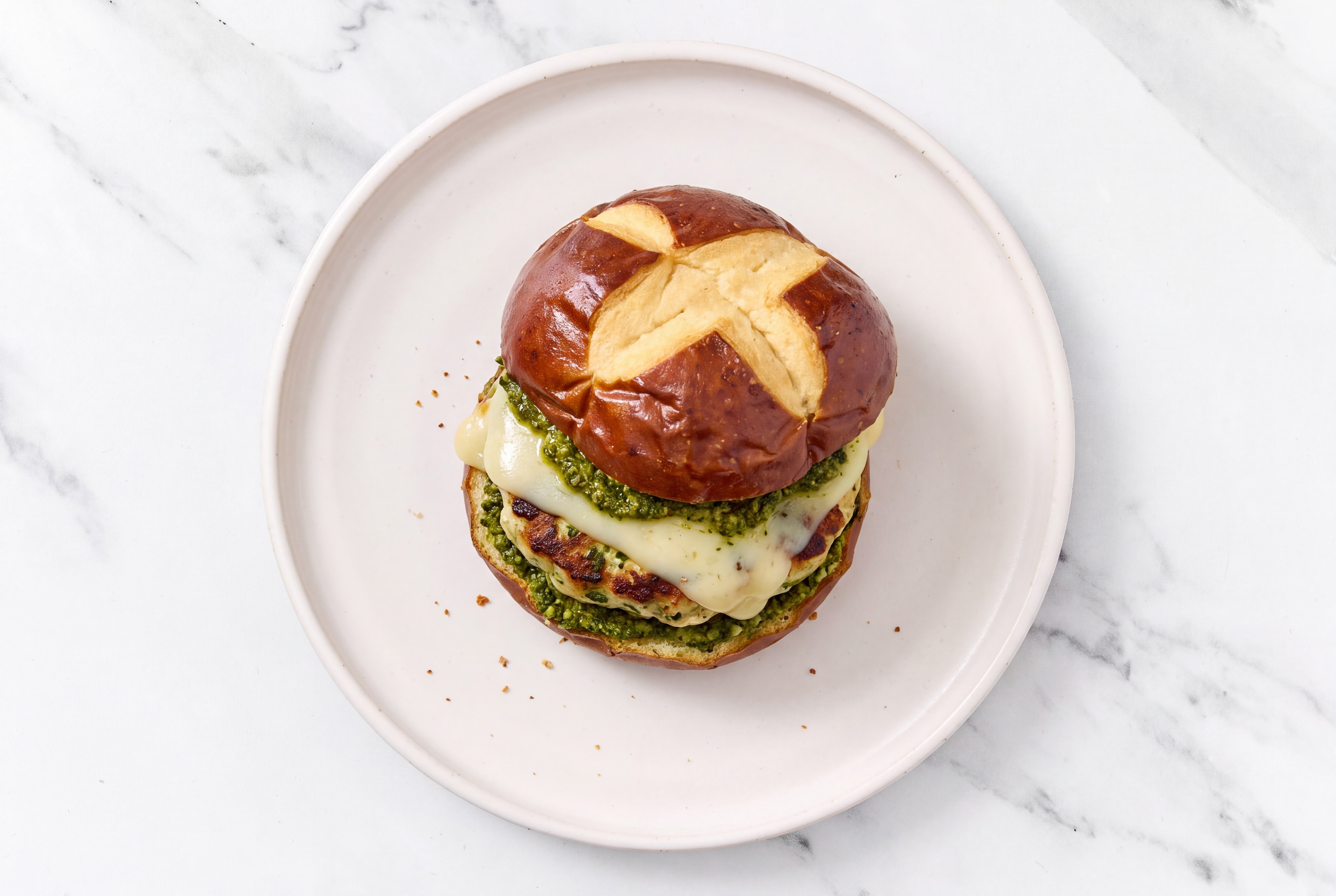 Garlic Turkey Burger on Pretzel with Spinach Pesto & Havarti