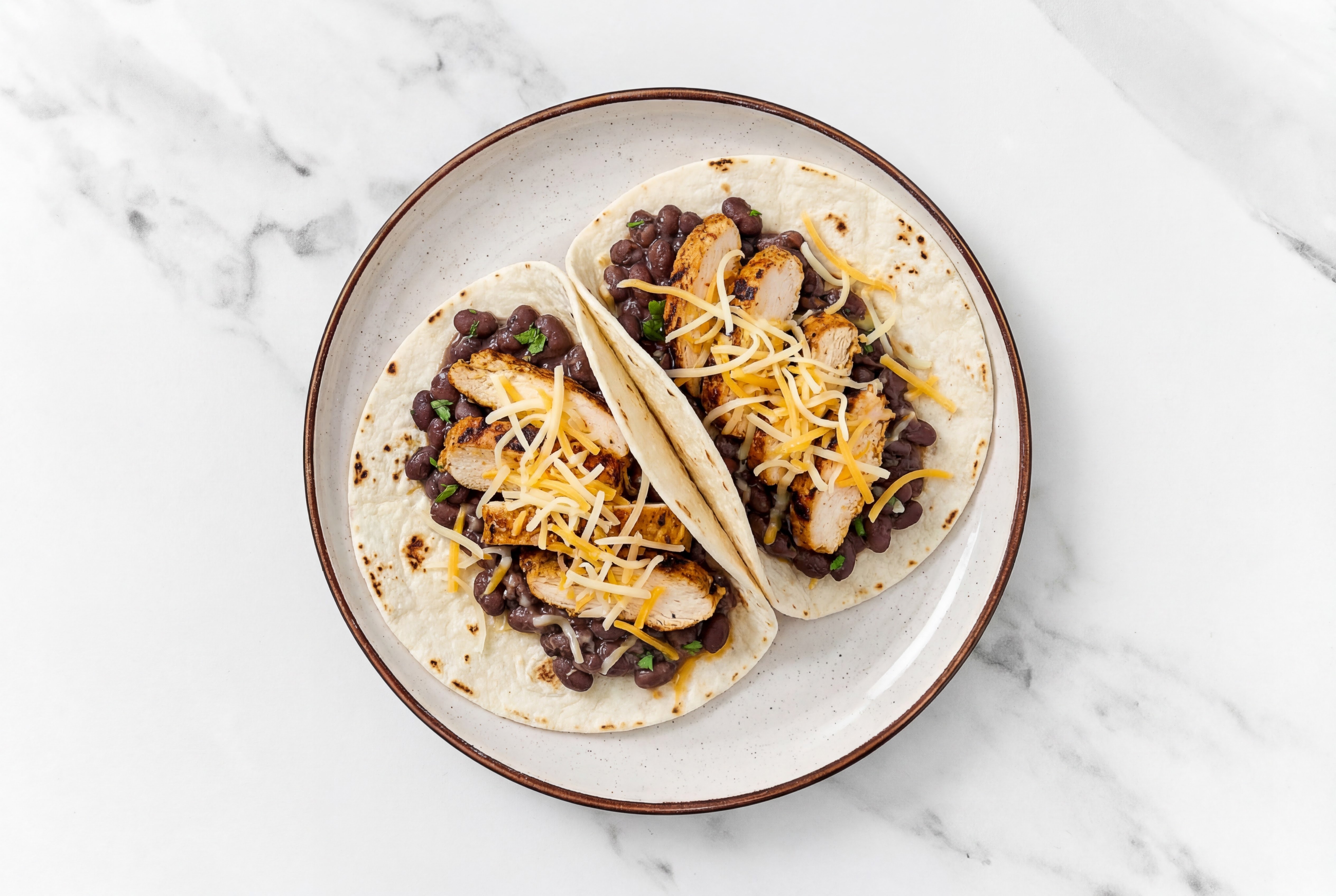 Hearty Blackened Chicken Tacos with Mexican Blend Cheese & Spiced Beans