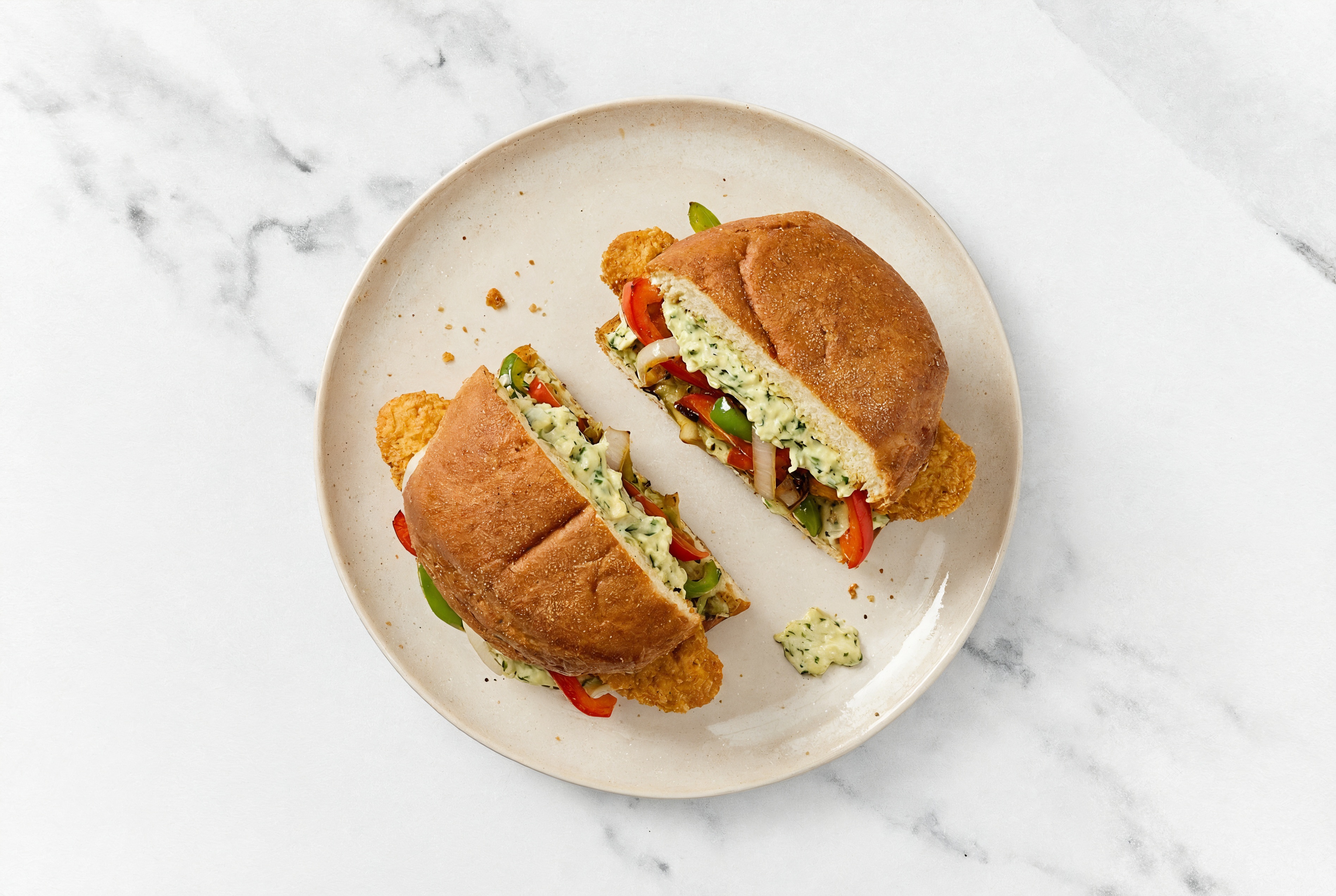 Creamy Artichoke "Chicken" Tenders Sandwich with Peppers + Onion on Gluten-Free Buns
