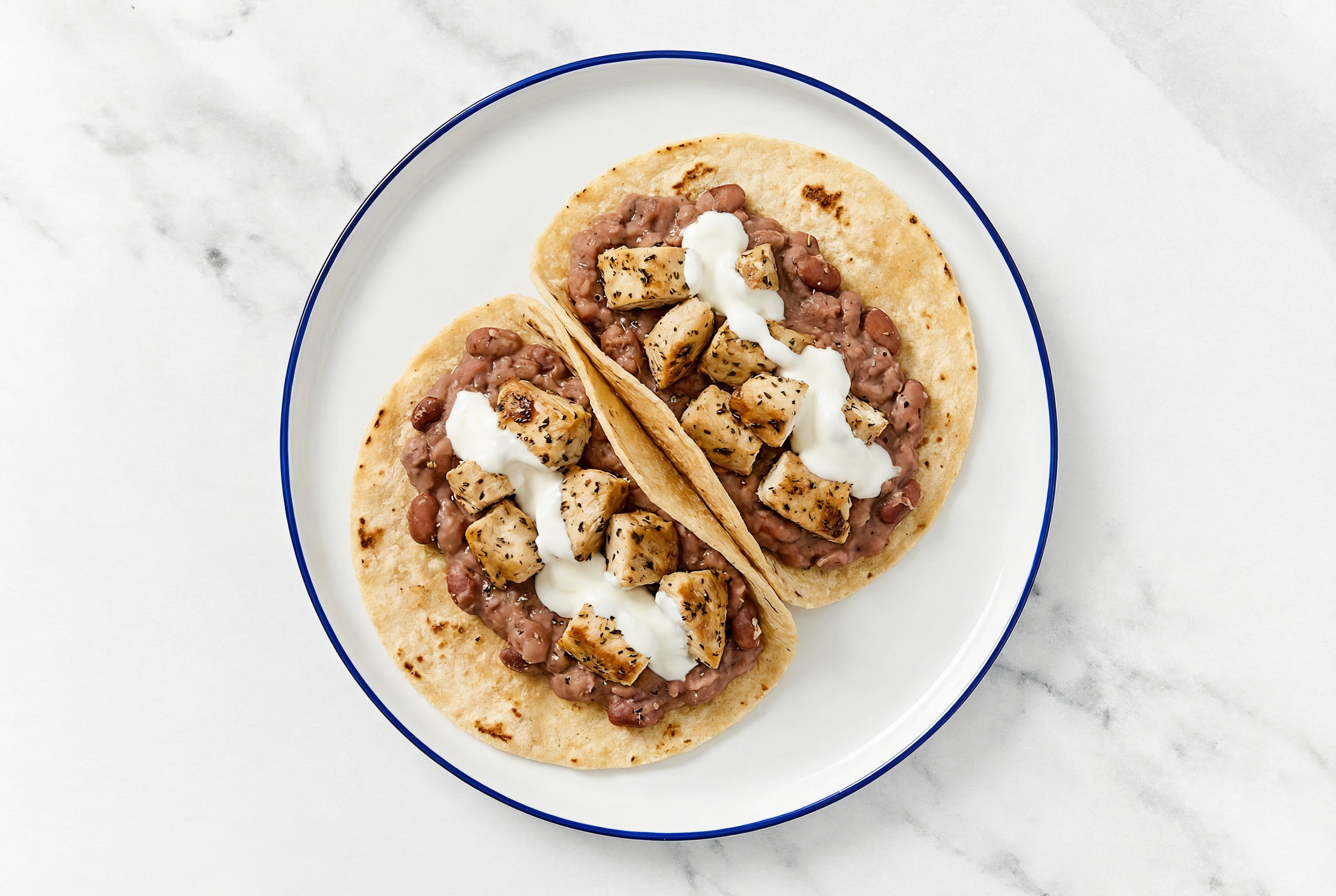 Garlic Chicken Tacos with Crema & Refried Red Beans