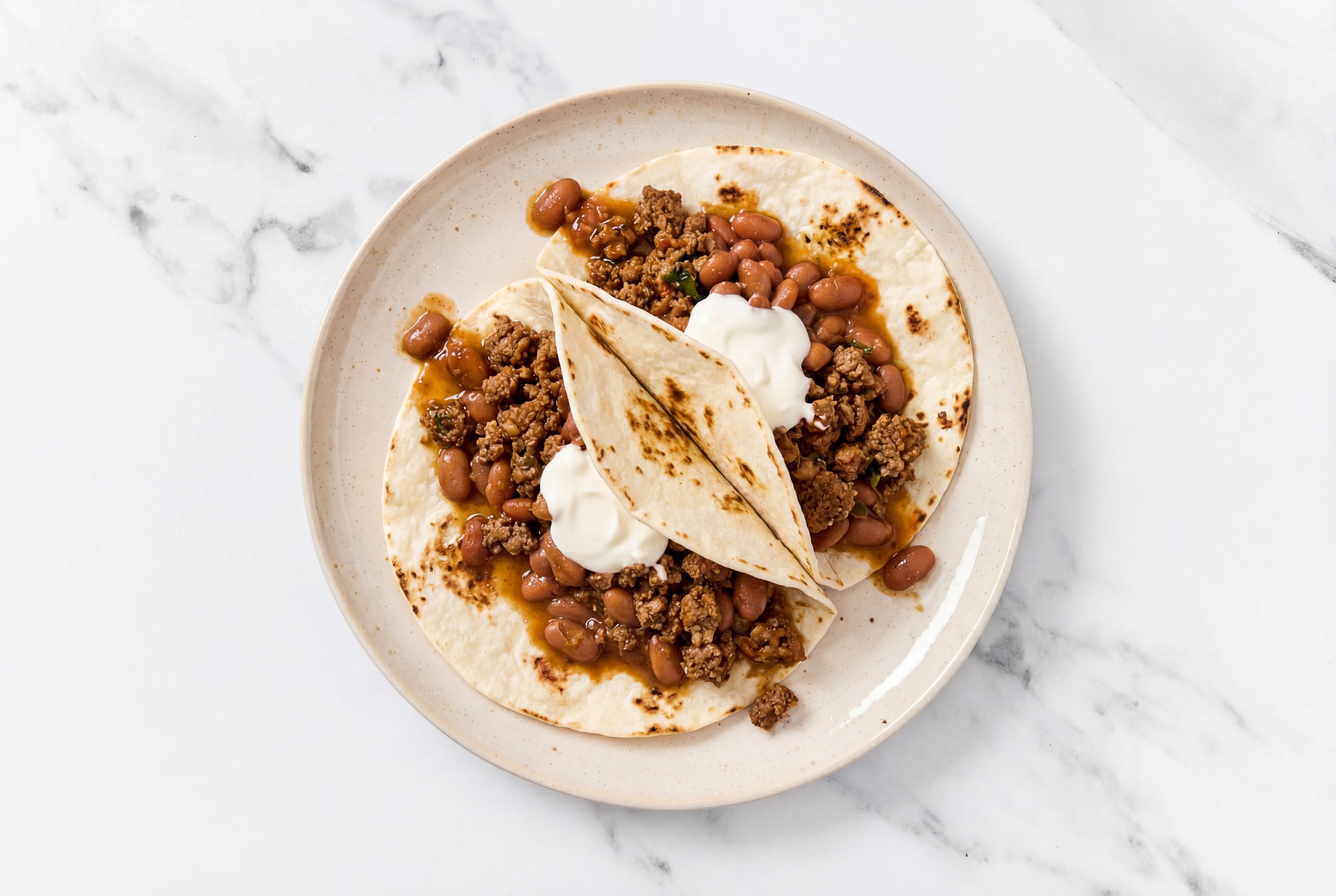 Mexican-Style Ground Beef Tacos with Crema & Pinto Beans