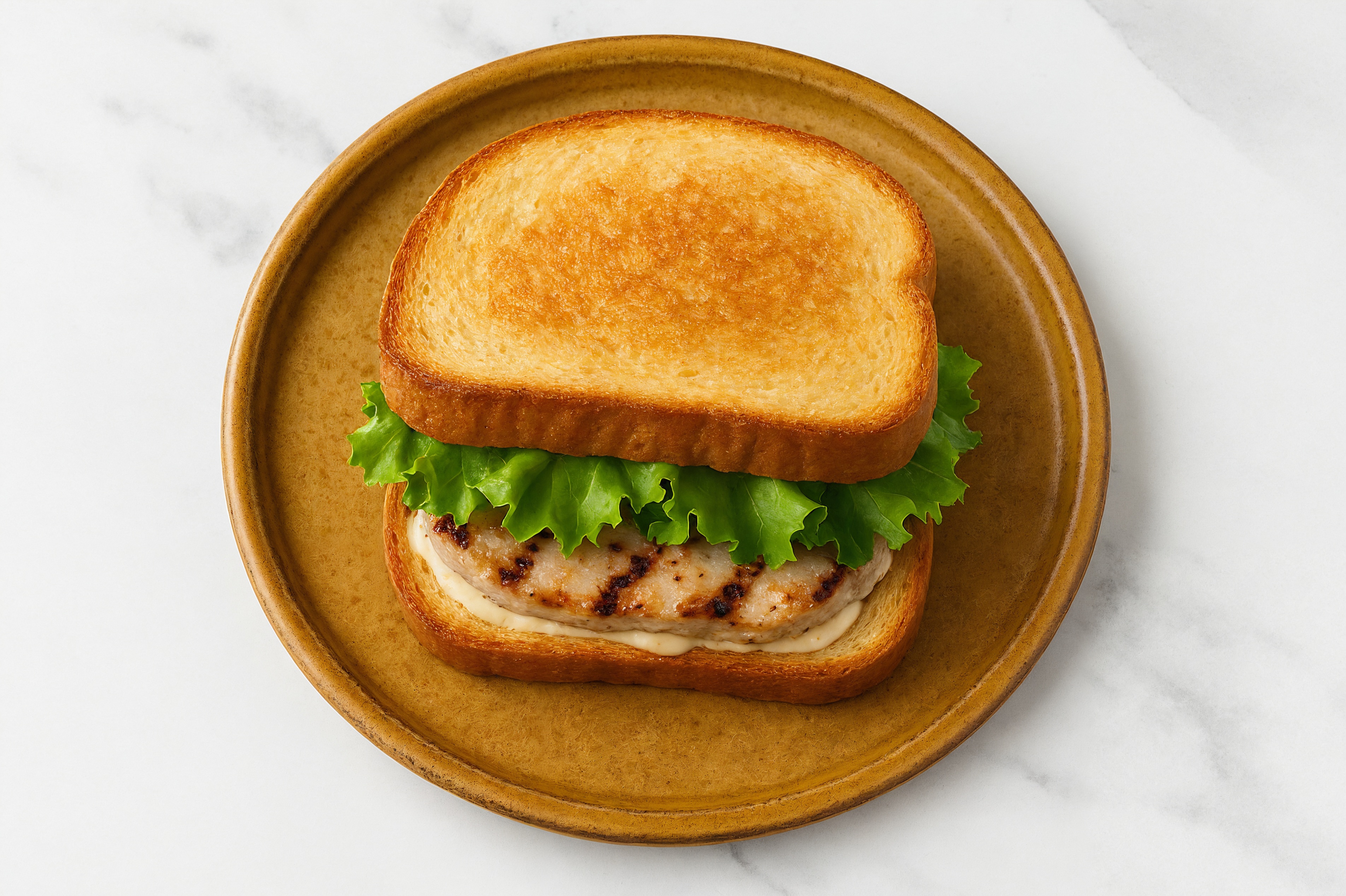Creamy Horseradish Grilled Pork Sandwich with Green Leaf Lettuce on Honey White Bread