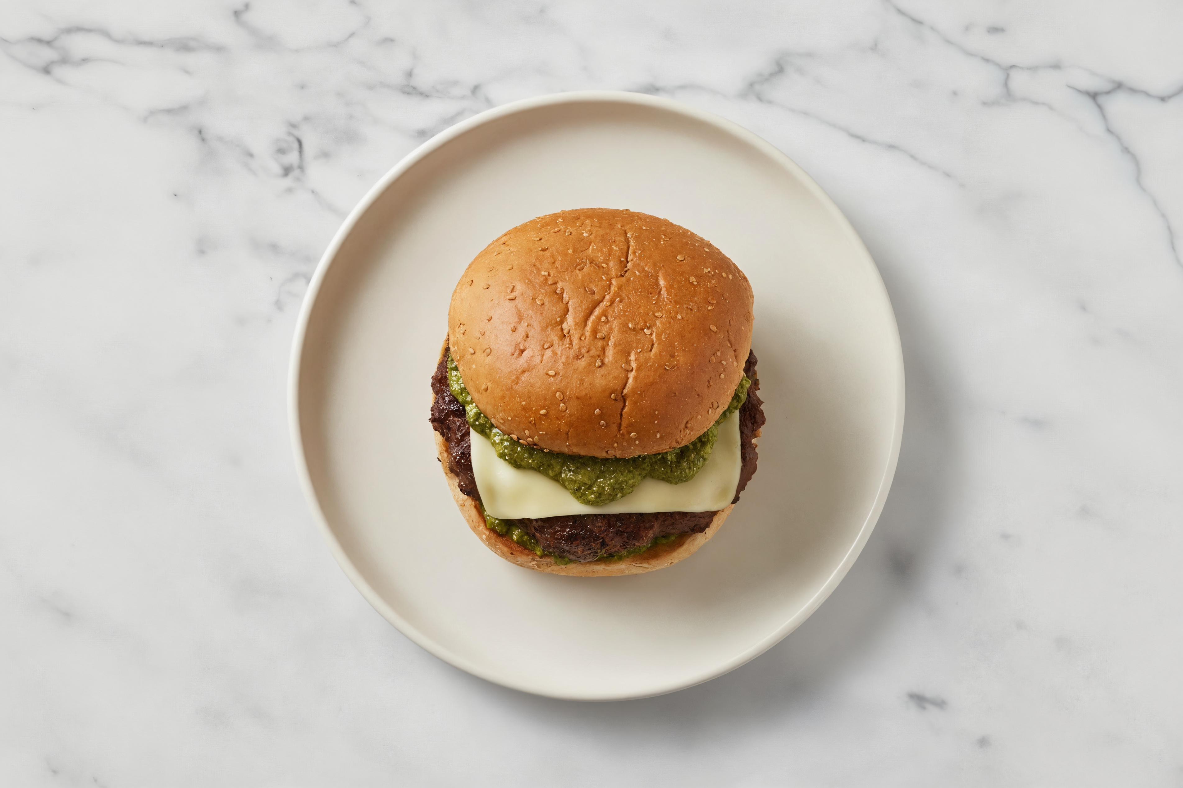 Bison Burger on Sprouted Grain with Spinach Pesto & Pepper Jack