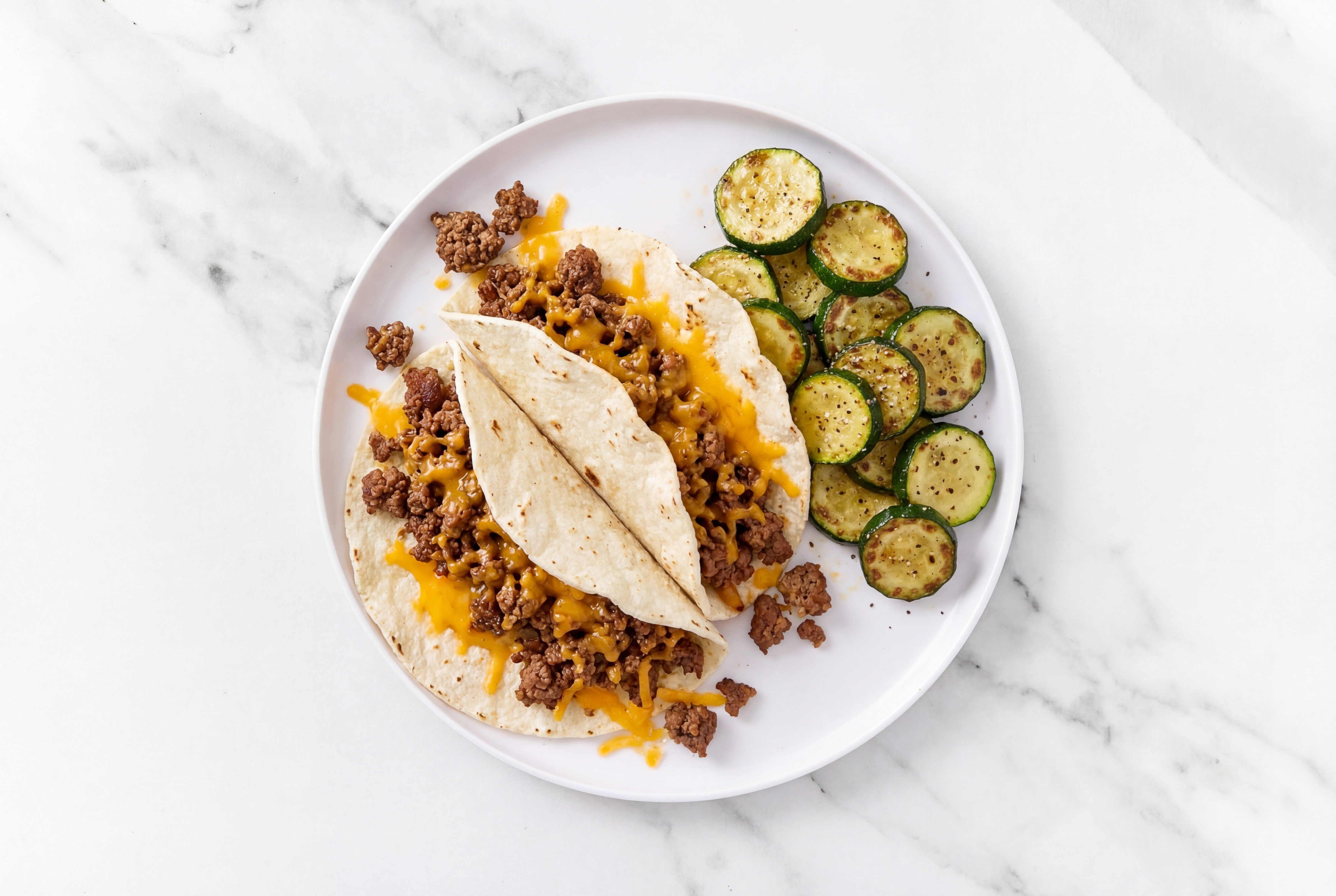 Loaded Cheesy Ground Beef Tacos + Zucchini with Shredded Sharp Cheddar Cheese