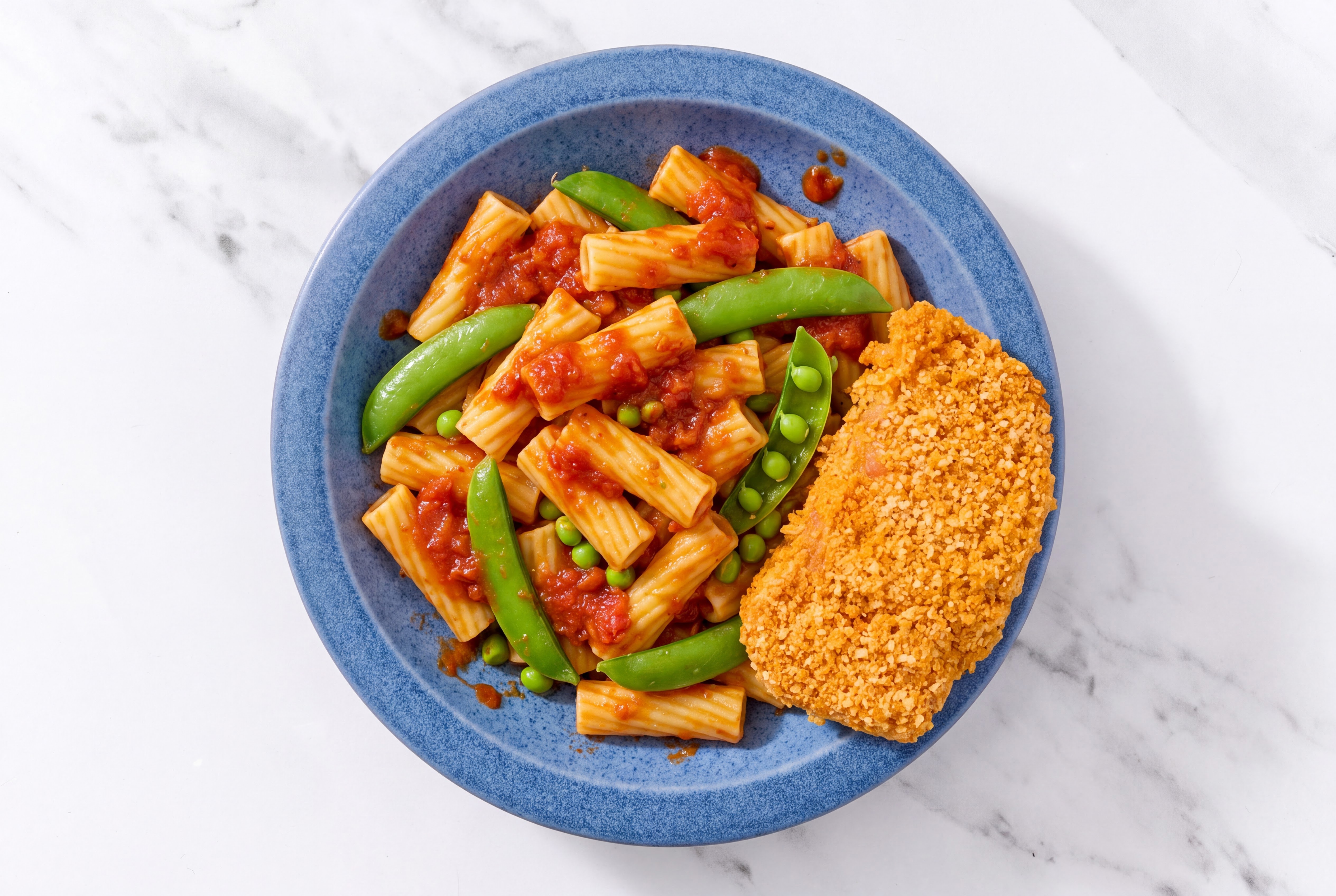 Crispy Hot Honey Chicken over Marinara Rigatoni with Snap Peas