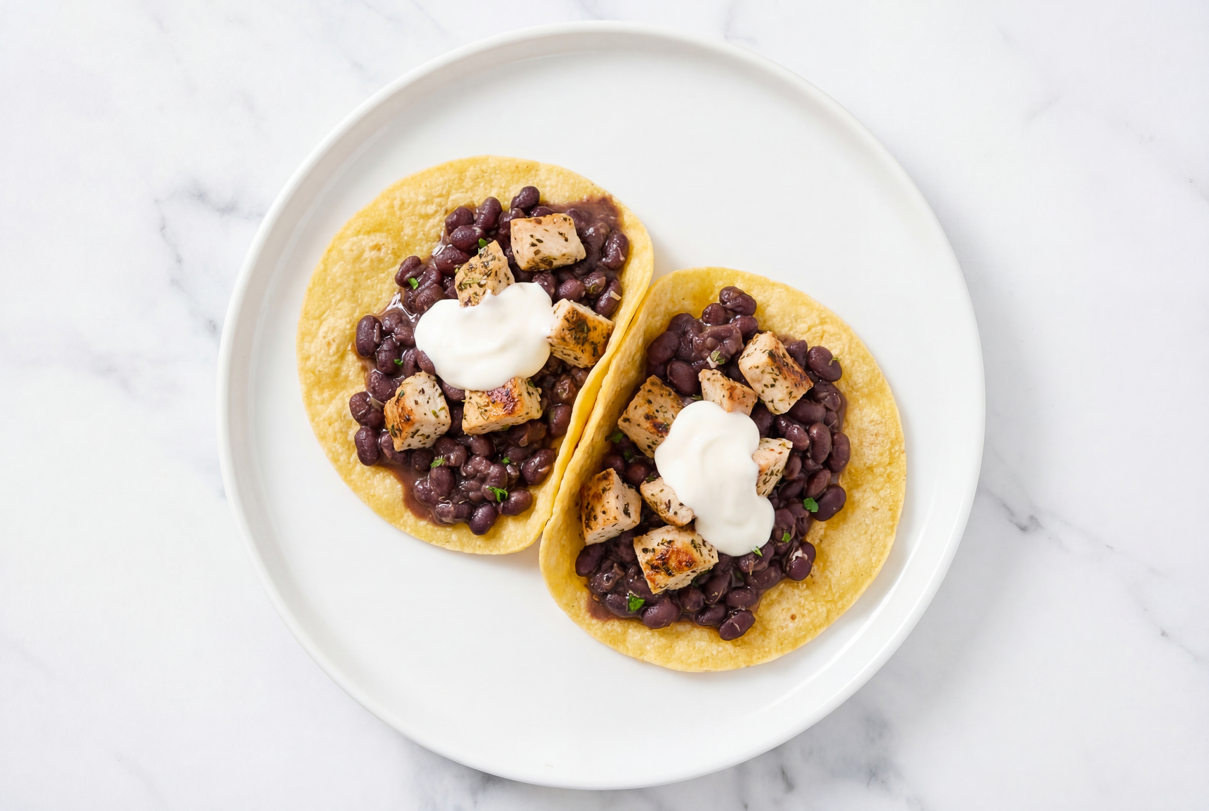 Herby Garlic Chicken Tacos with Crema & Spiced Beans