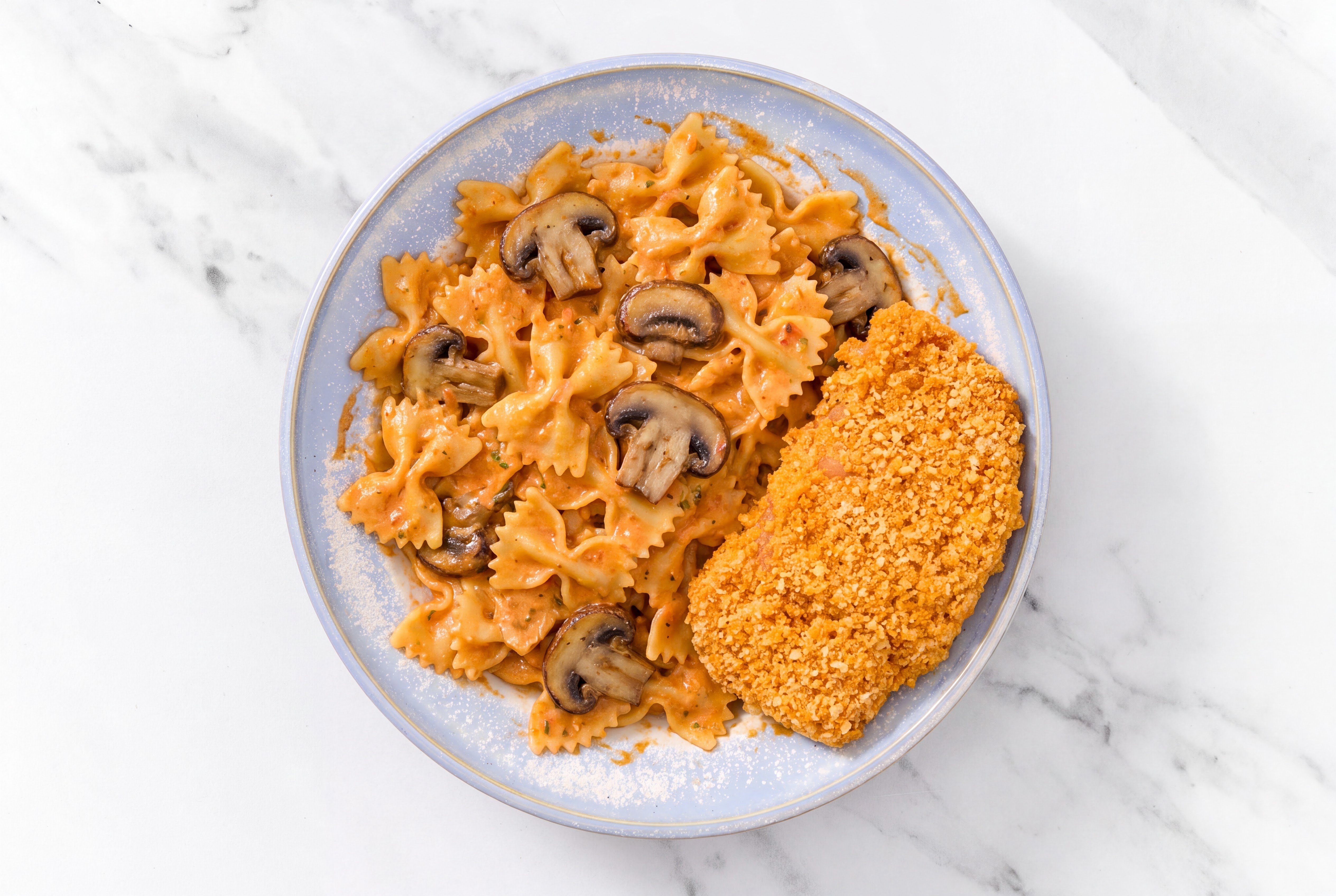 Crispy Hot Honey Chicken over Creamy Vodka Farfalle with Baby Bella Mushrooms