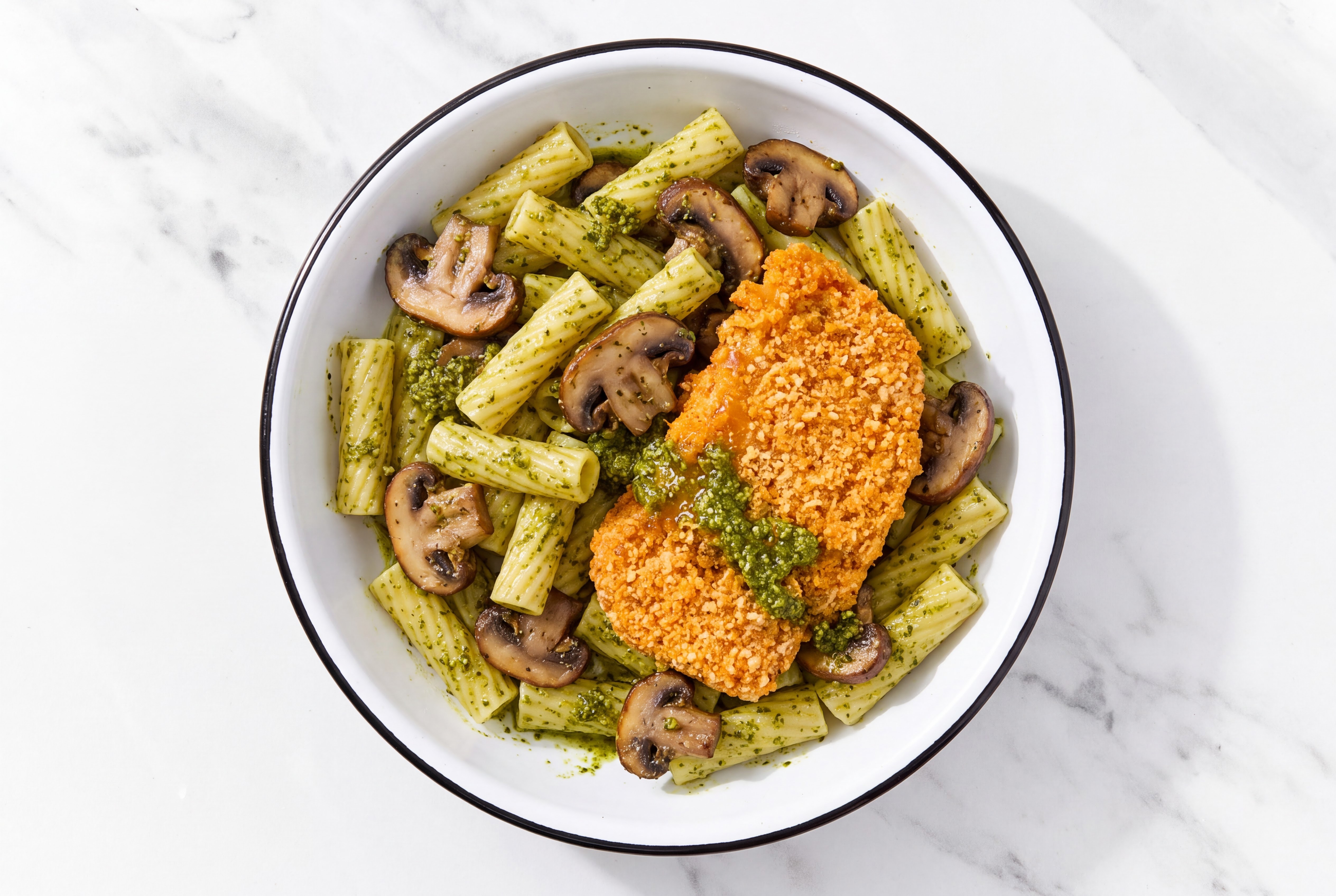 Crispy Hot Honey Chicken over Pesto Rigatoni with Baby Bella Mushrooms