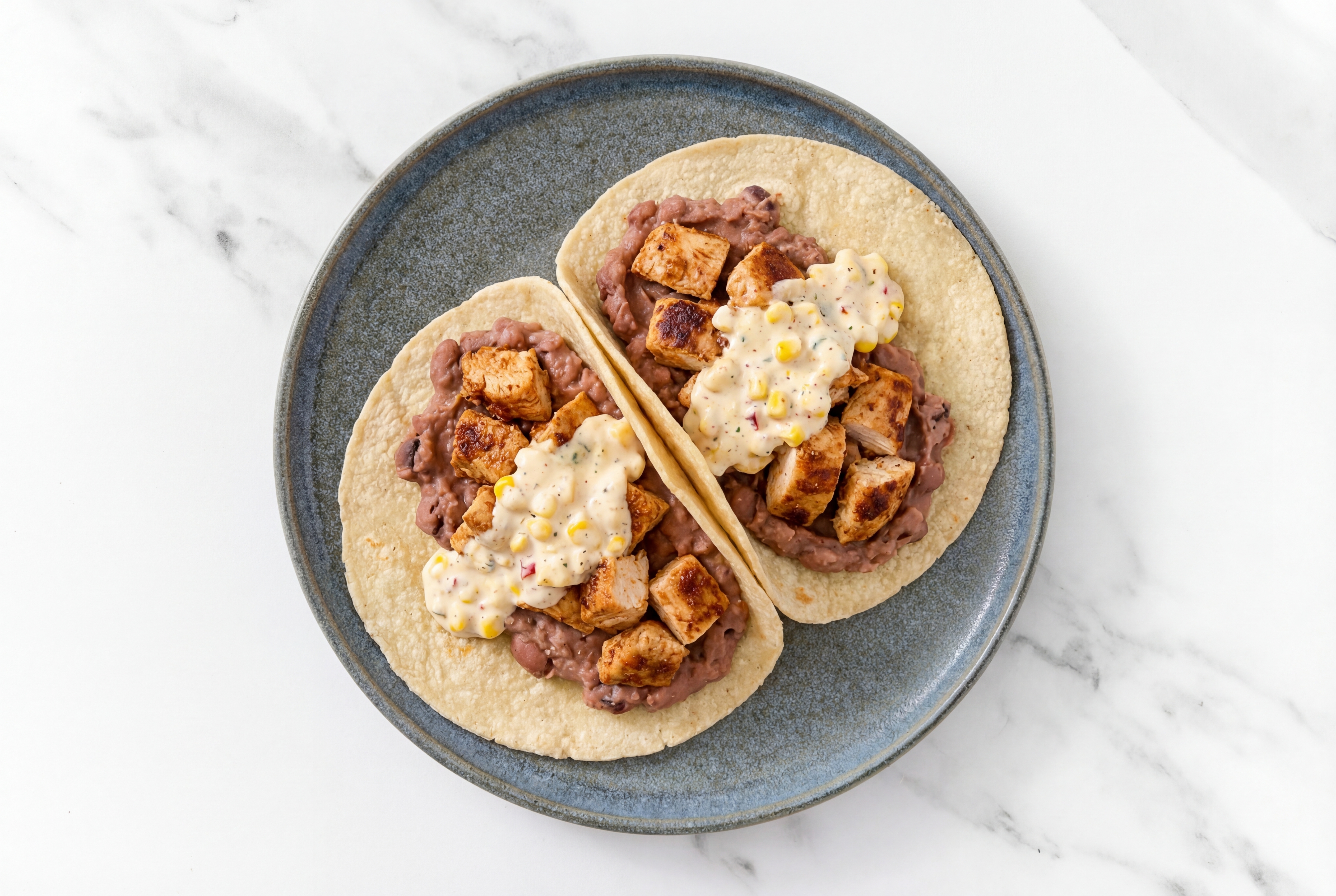 Chipotle Chicken Tacos with Street Corn Sauce & Refried Red Beans