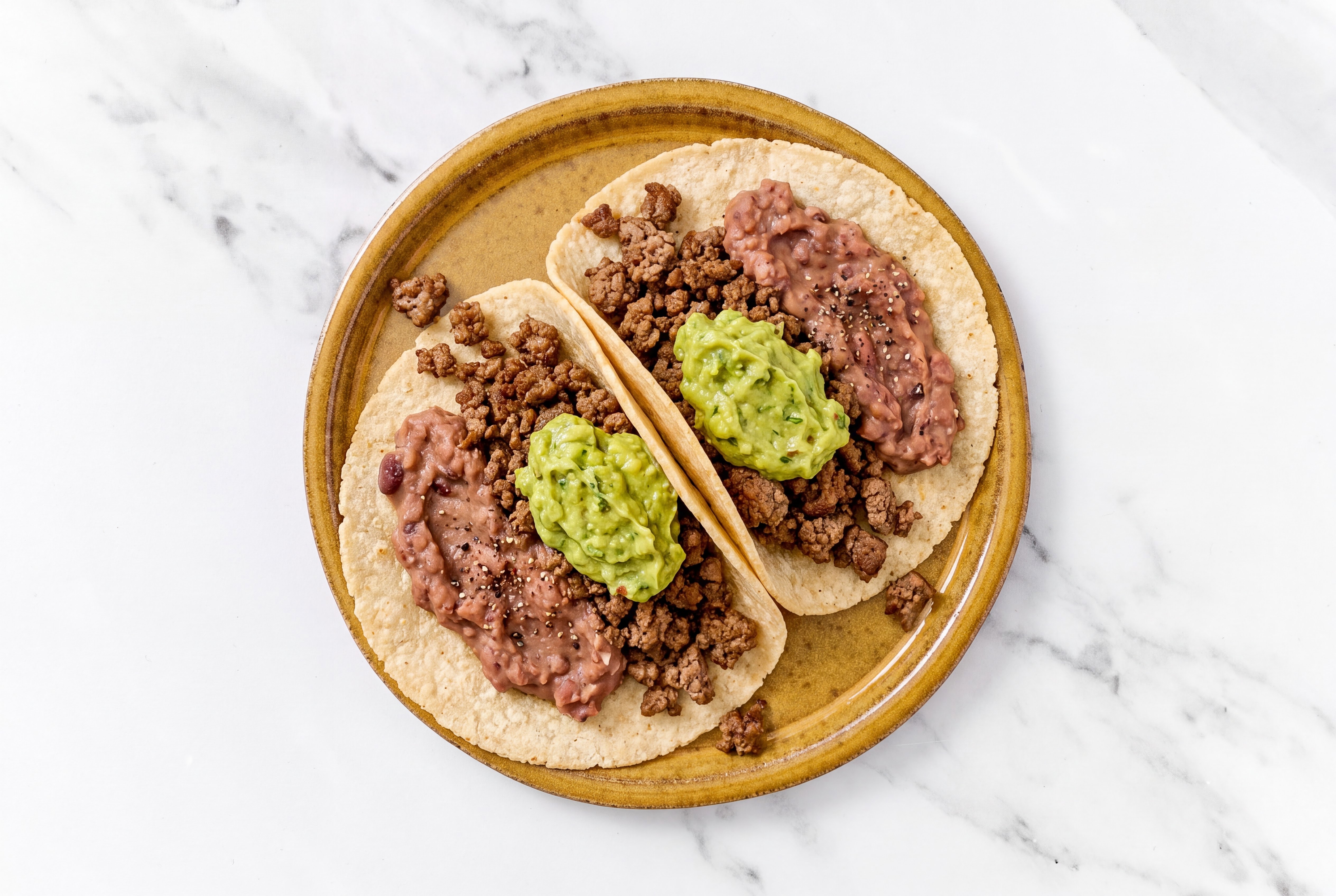 Ground 93/7 Lean Beef Tacos with Guacamole & Refried Red Beans