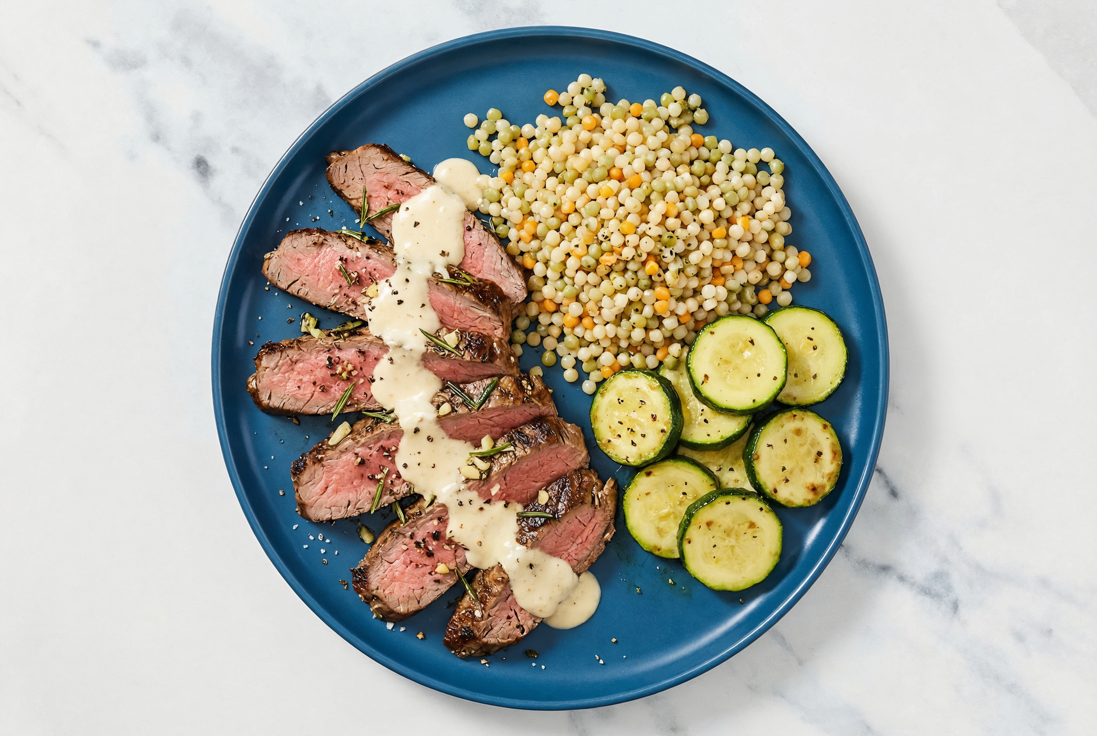Horseradish Rosemary Garlic Beef Flank Steak + Zucchini Couscous