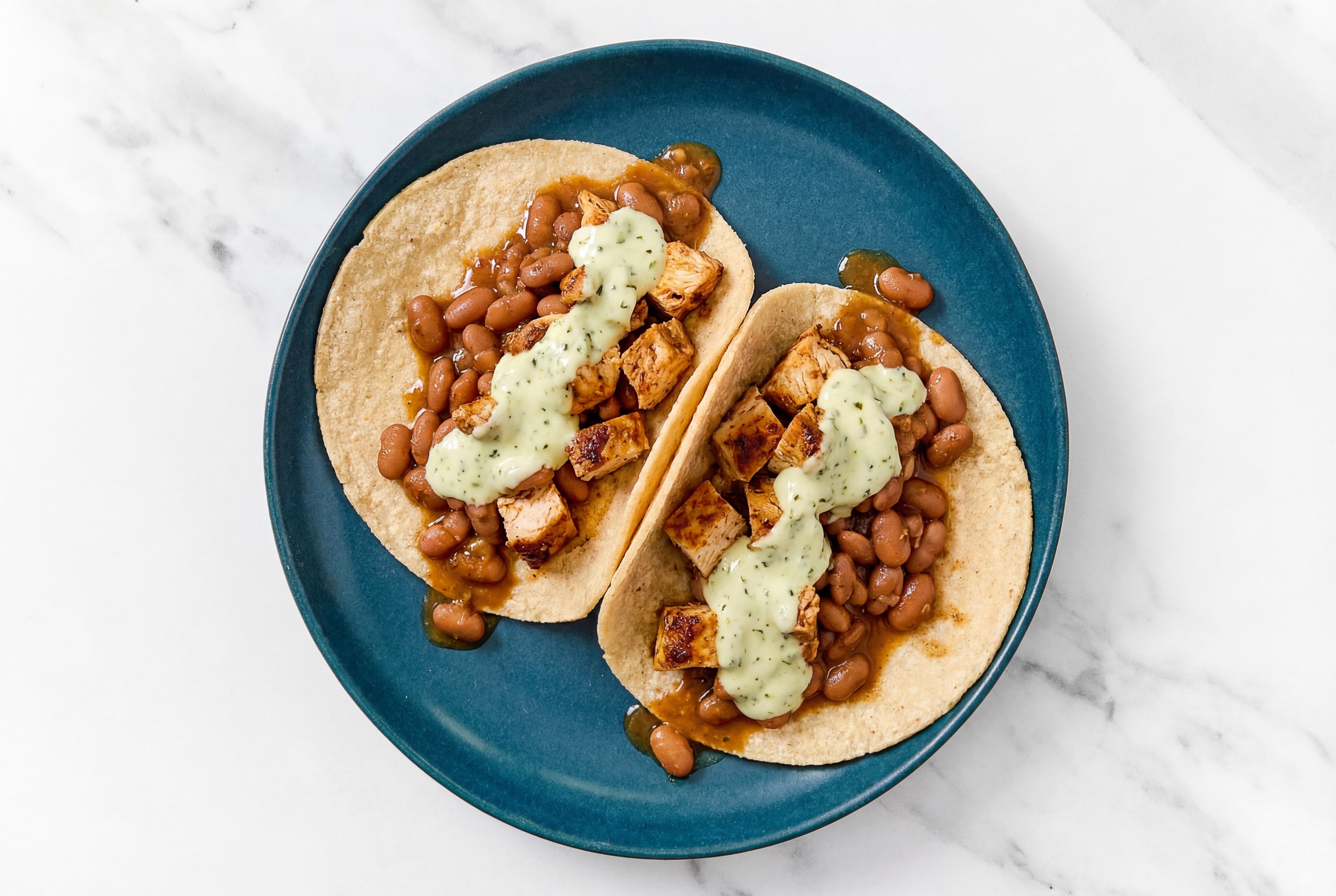 Chipotle Chicken Tacos with Jalapeño Crema & Pinto Beans