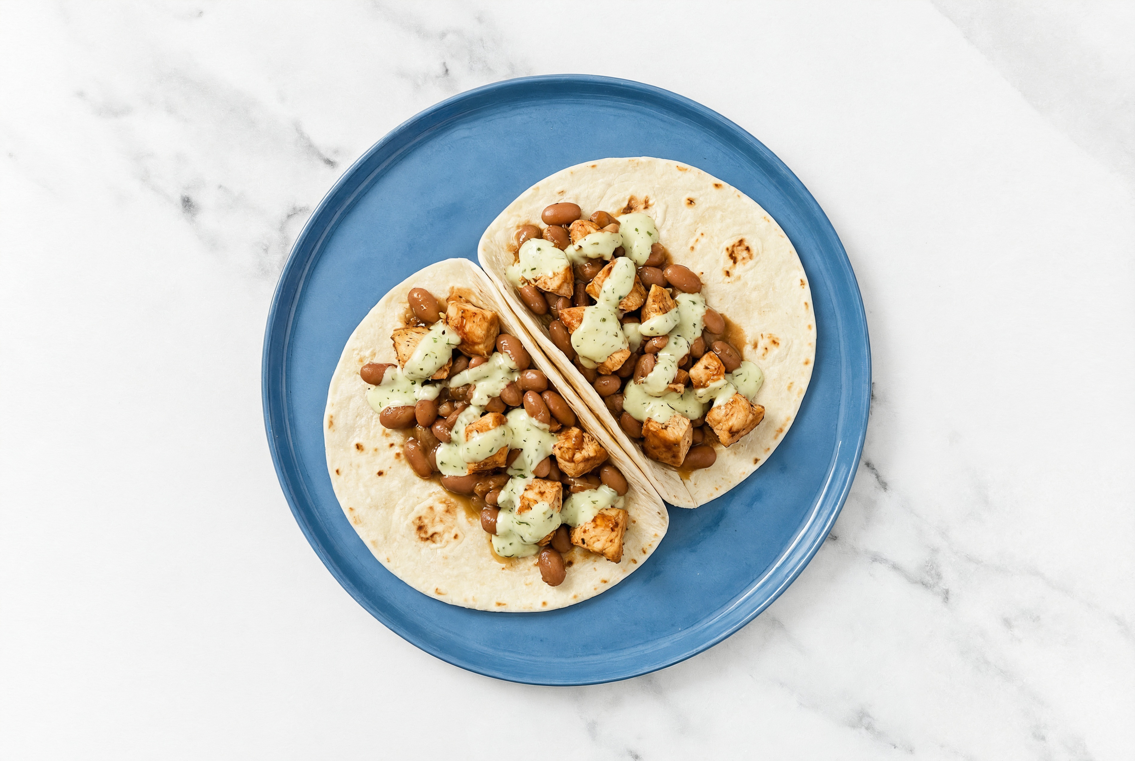 Chipotle Chicken Tacos with Jalapeño Crema & Pinto Beans