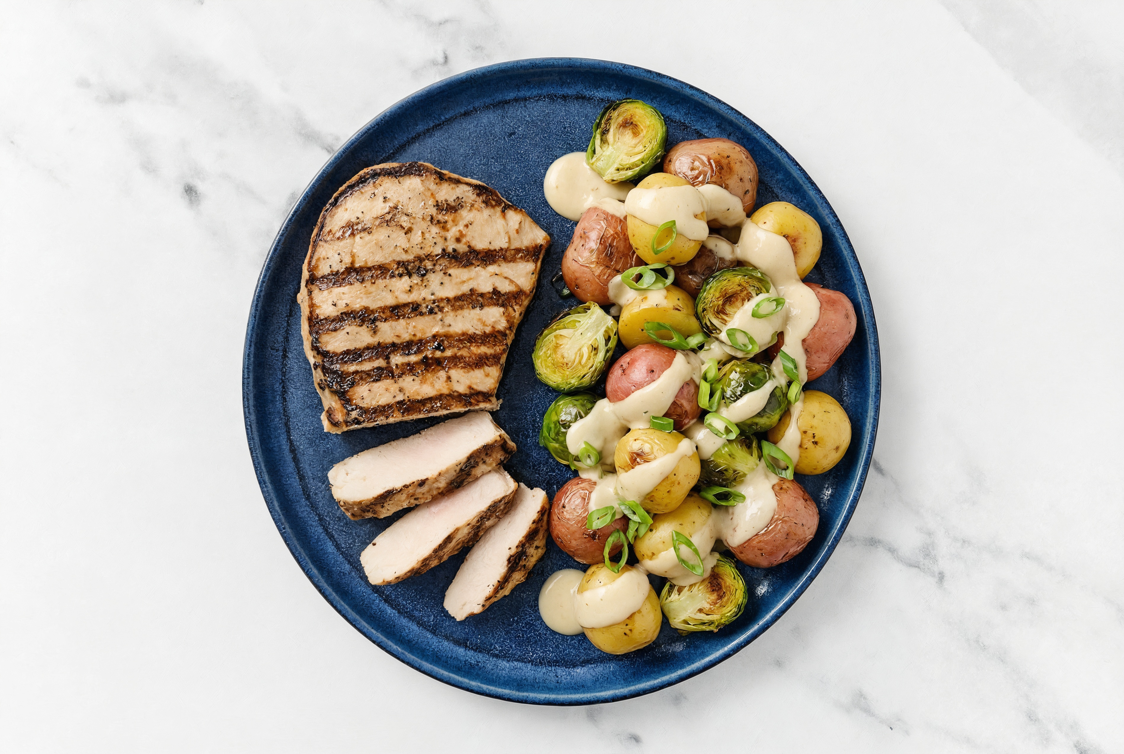 Grilled Pork Chop with Brussels + Creamy Potatoes