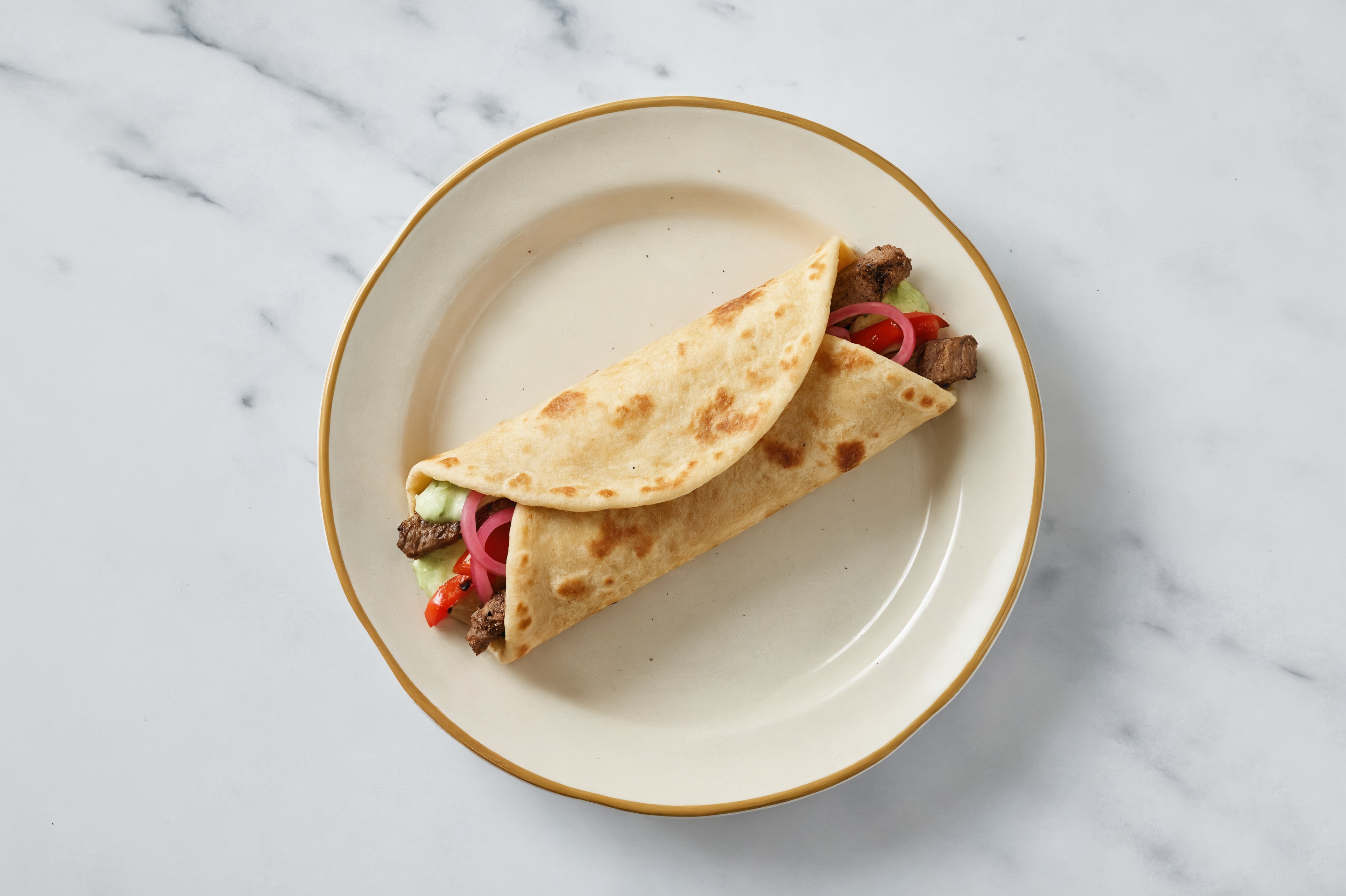 Barbacoa Beef Wrap with Jalapeño Crema + Pickled Onions
