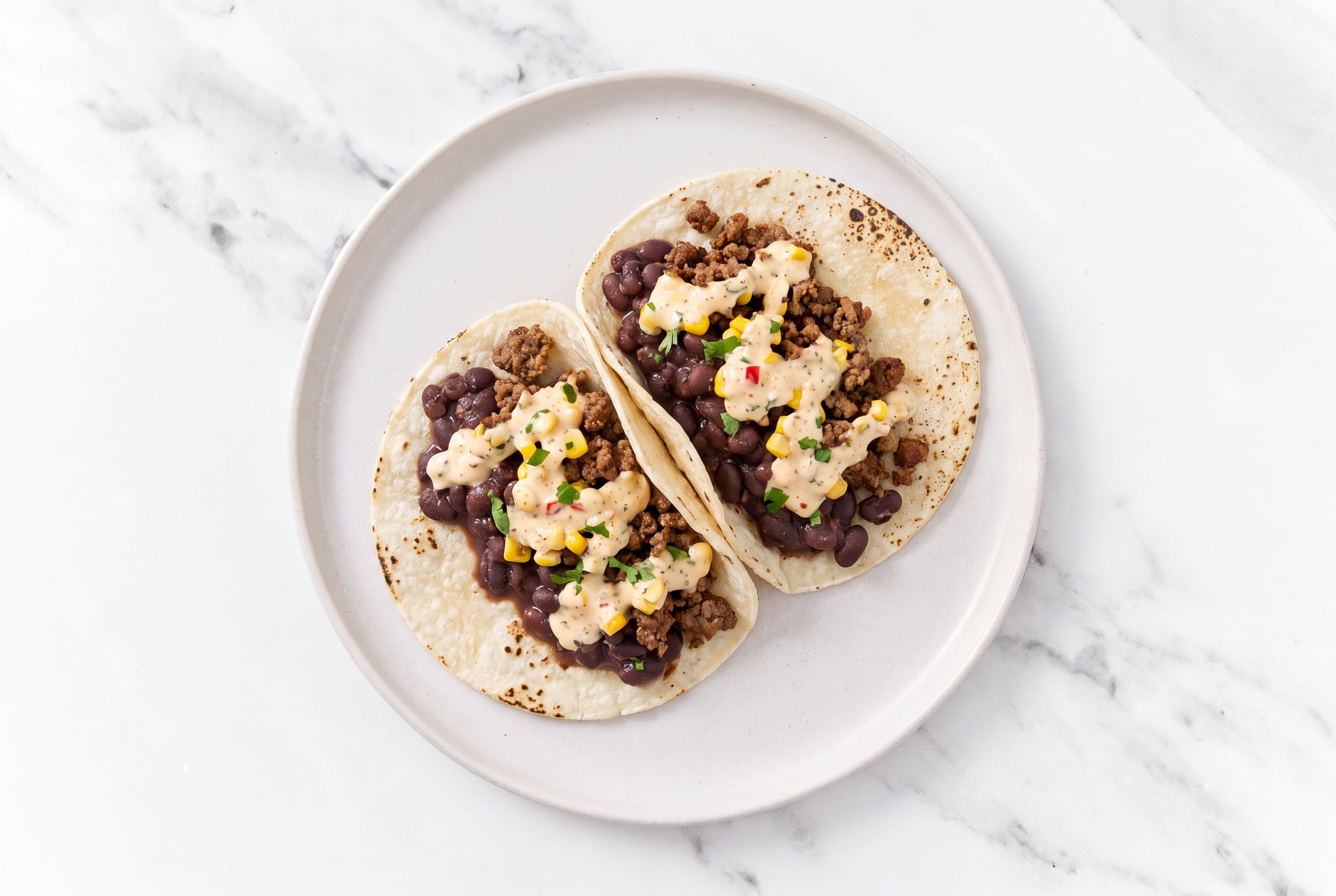 Ground 93/7 Lean Beef Tacos with Street White Corn Tortillas Sauce & Spiced Beans