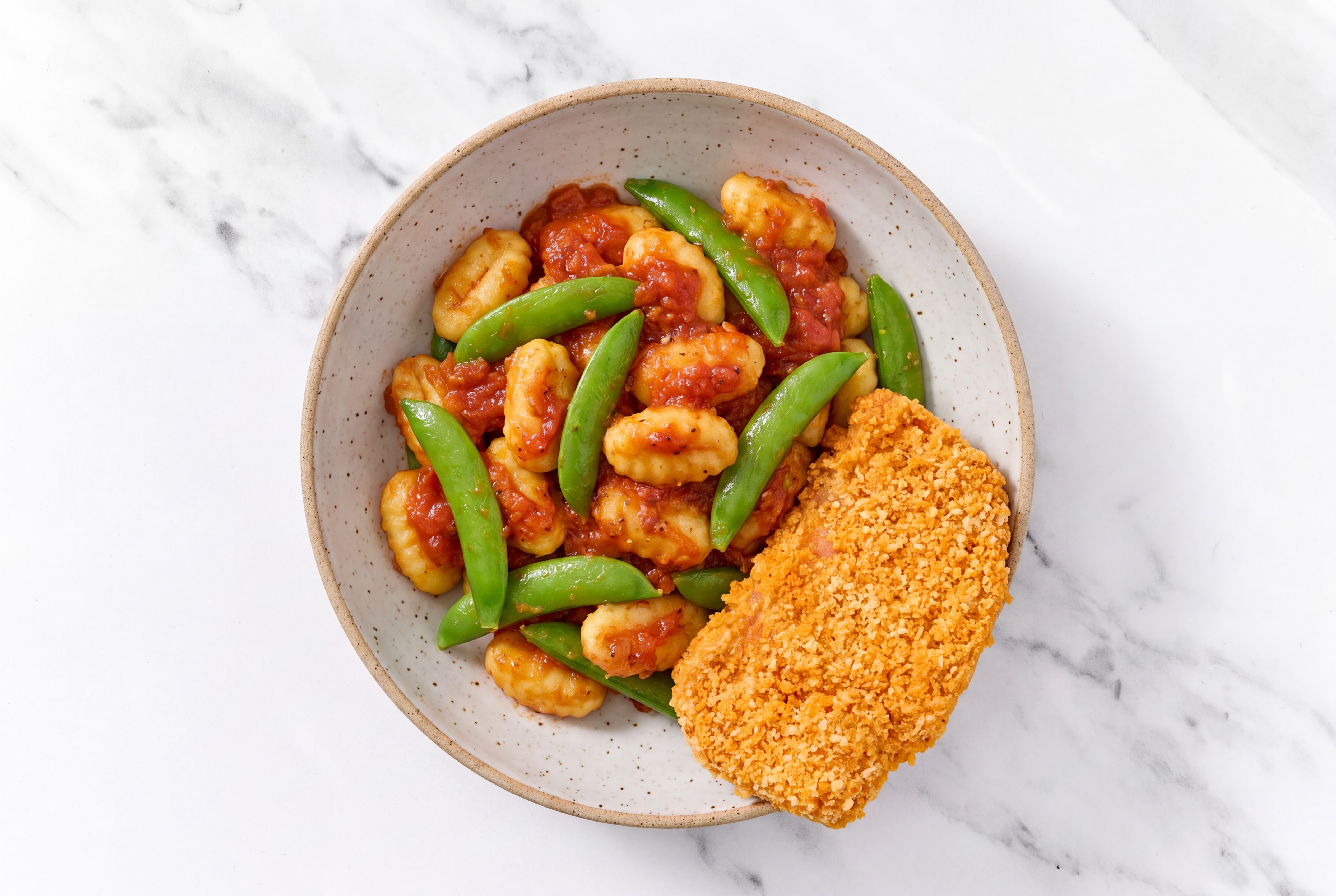 Crispy Hot Honey Chicken over Marinara Gnocchi with Snap Peas