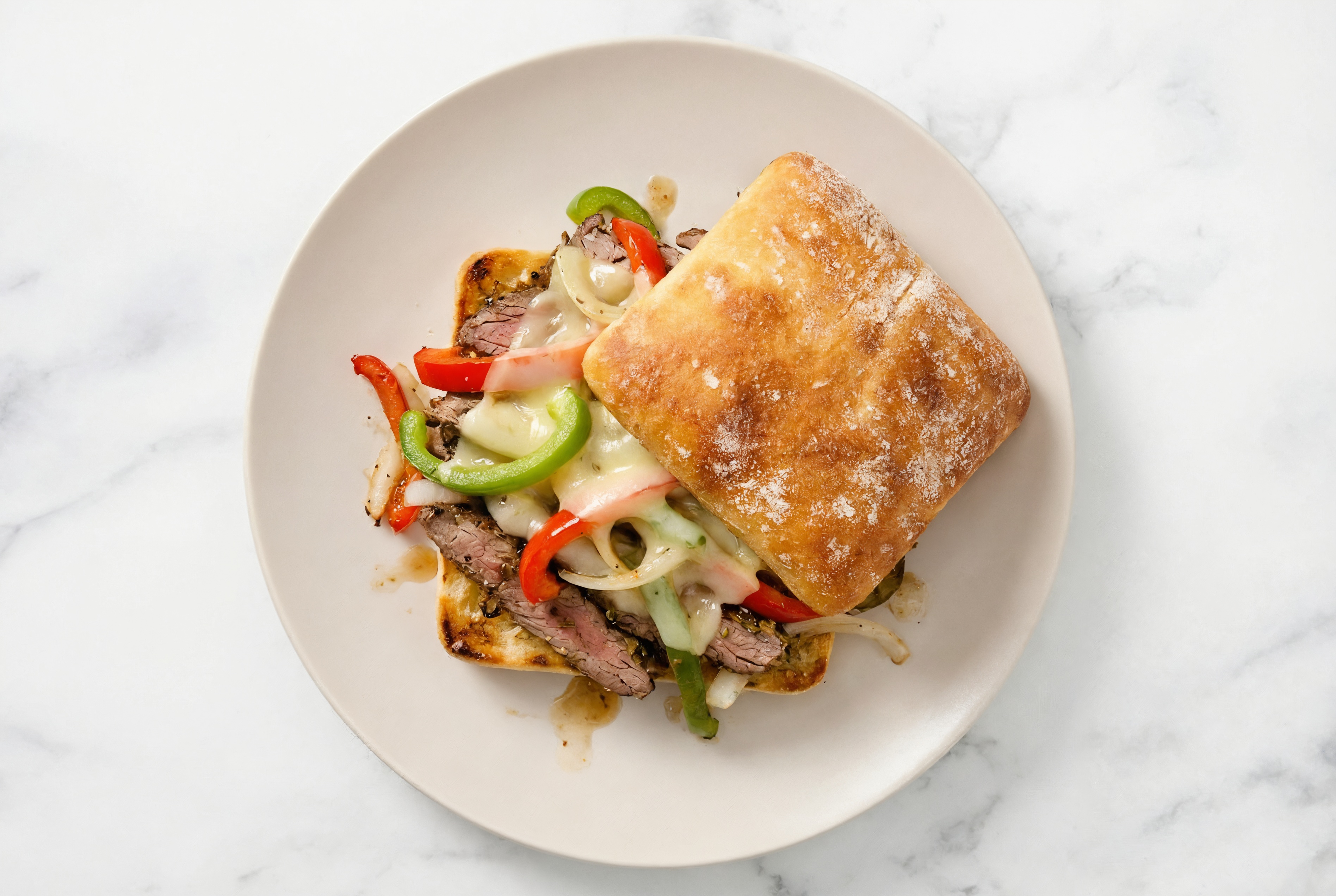 Easy-Cleanup Ciabatta Philly Cheesesteak with Rosemary Garlic Beef Flank Steak