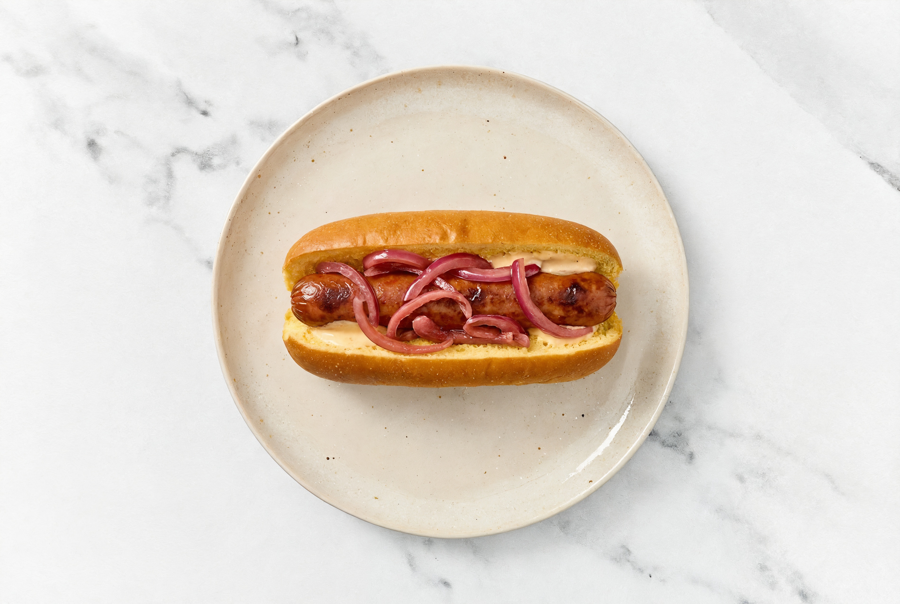 Pickled Red Onion Beef Hot Dog with Awesome Sauce on Brioche
