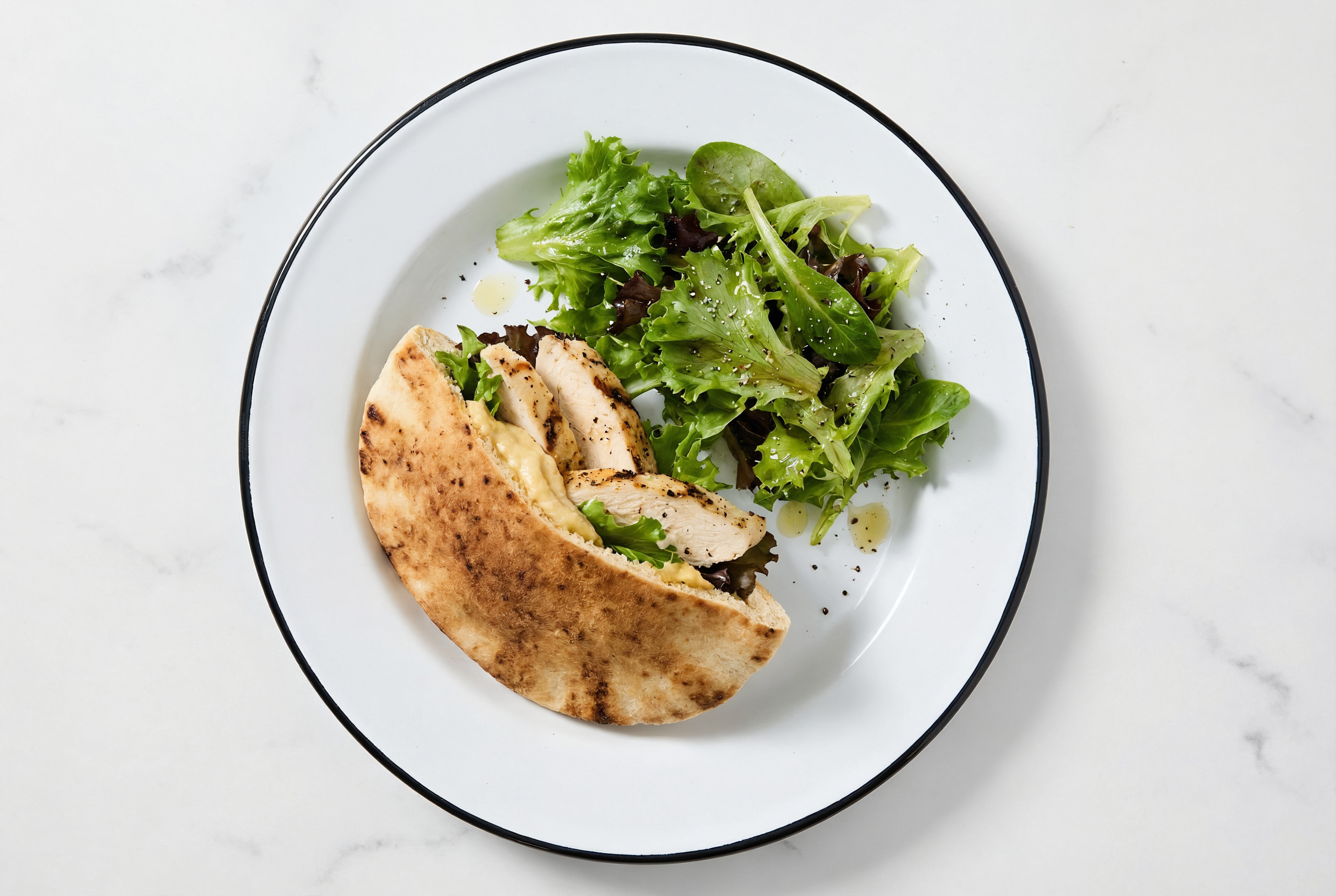 Hearty Shawarma-Inspired Seasoned Grilled Chicken Breast Traditional Pita Sandwich