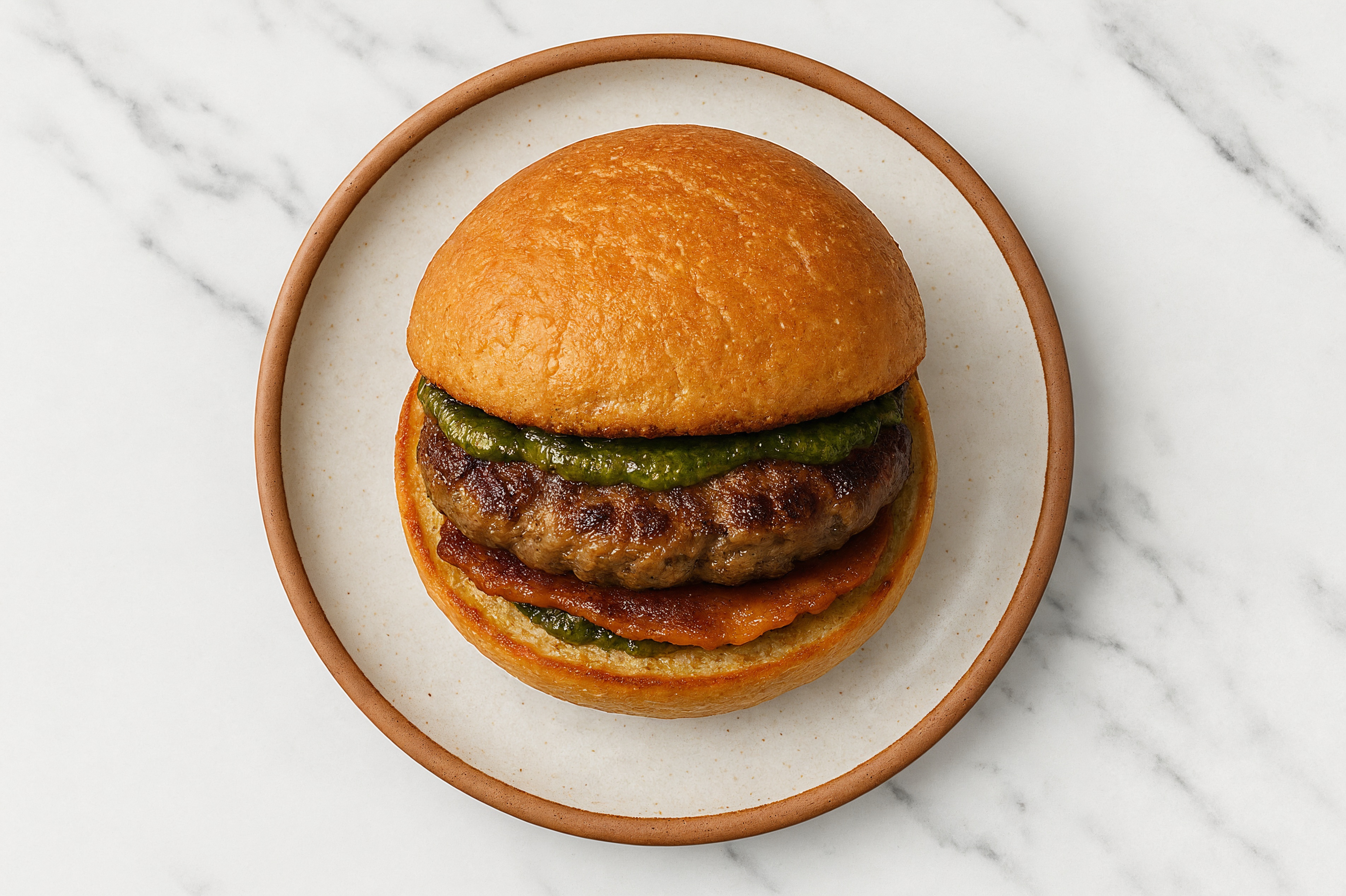 Ground Lamb Burger on Gluten-Free Bun with Pesto & Turkey Bacon