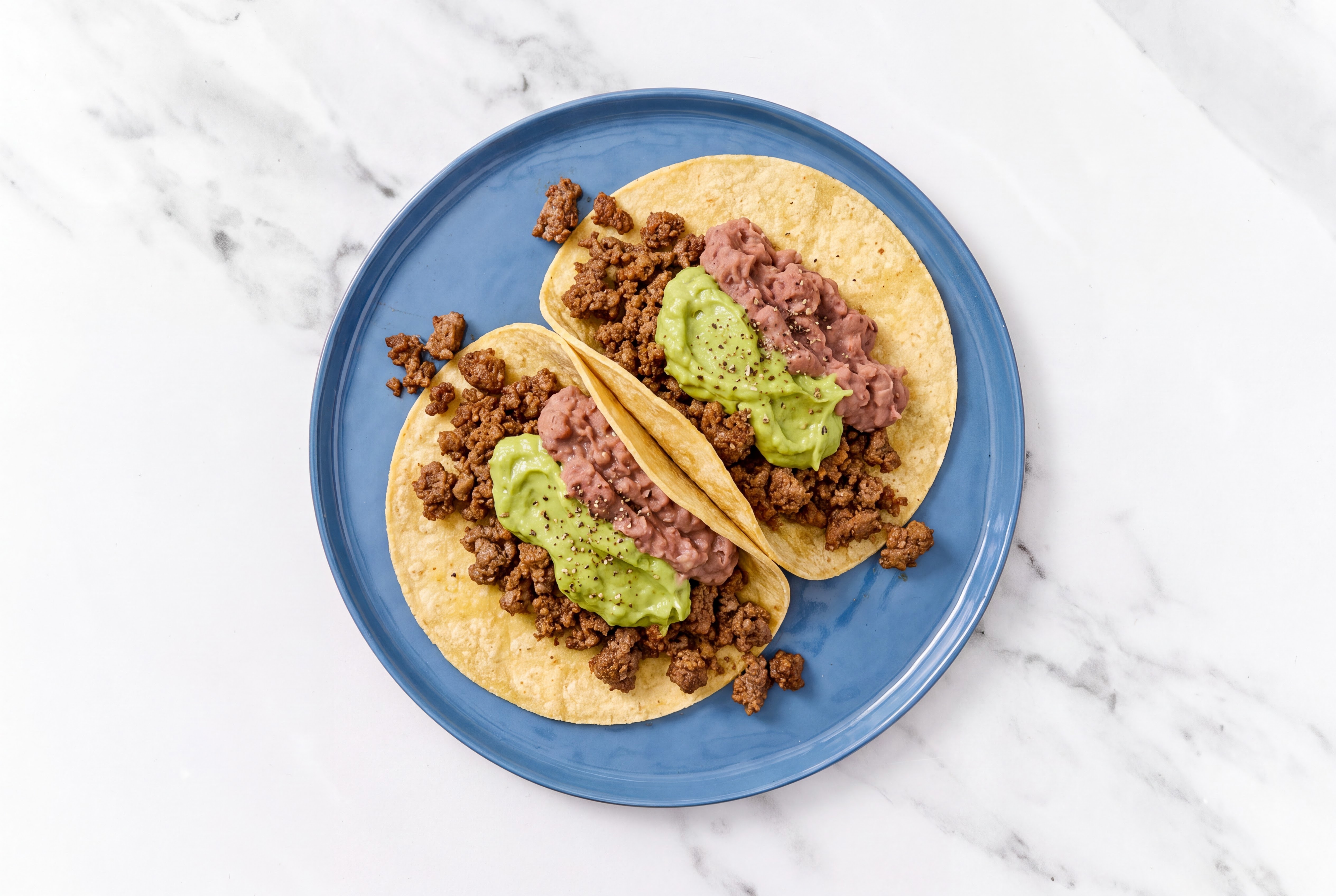 Herby Ground 93/7 Lean Beef Tacos with Avocado & Refried Red Beans