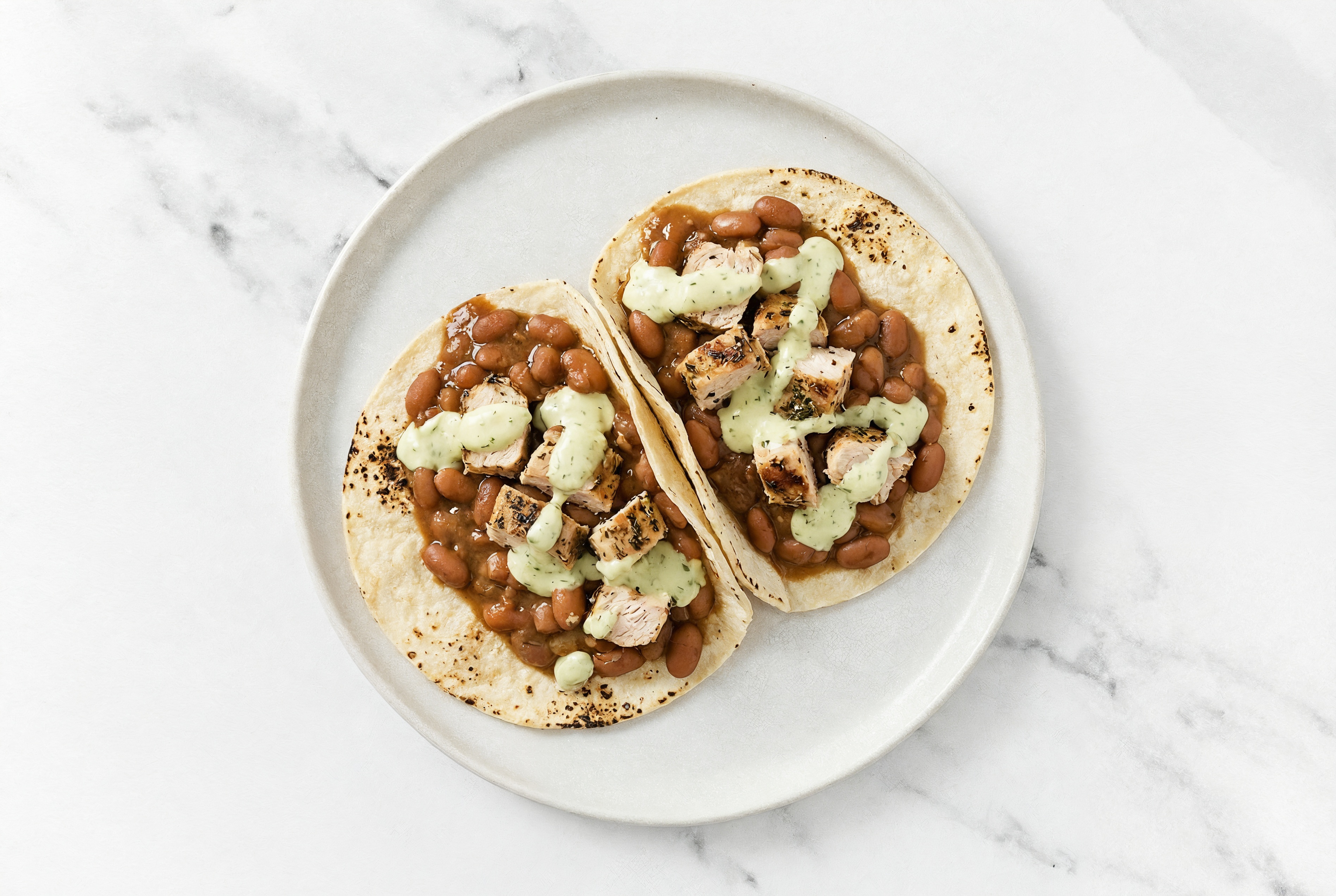 Hearty Chipotle Turkey Tacos with Jalapeño Crema & Pinto Beans
