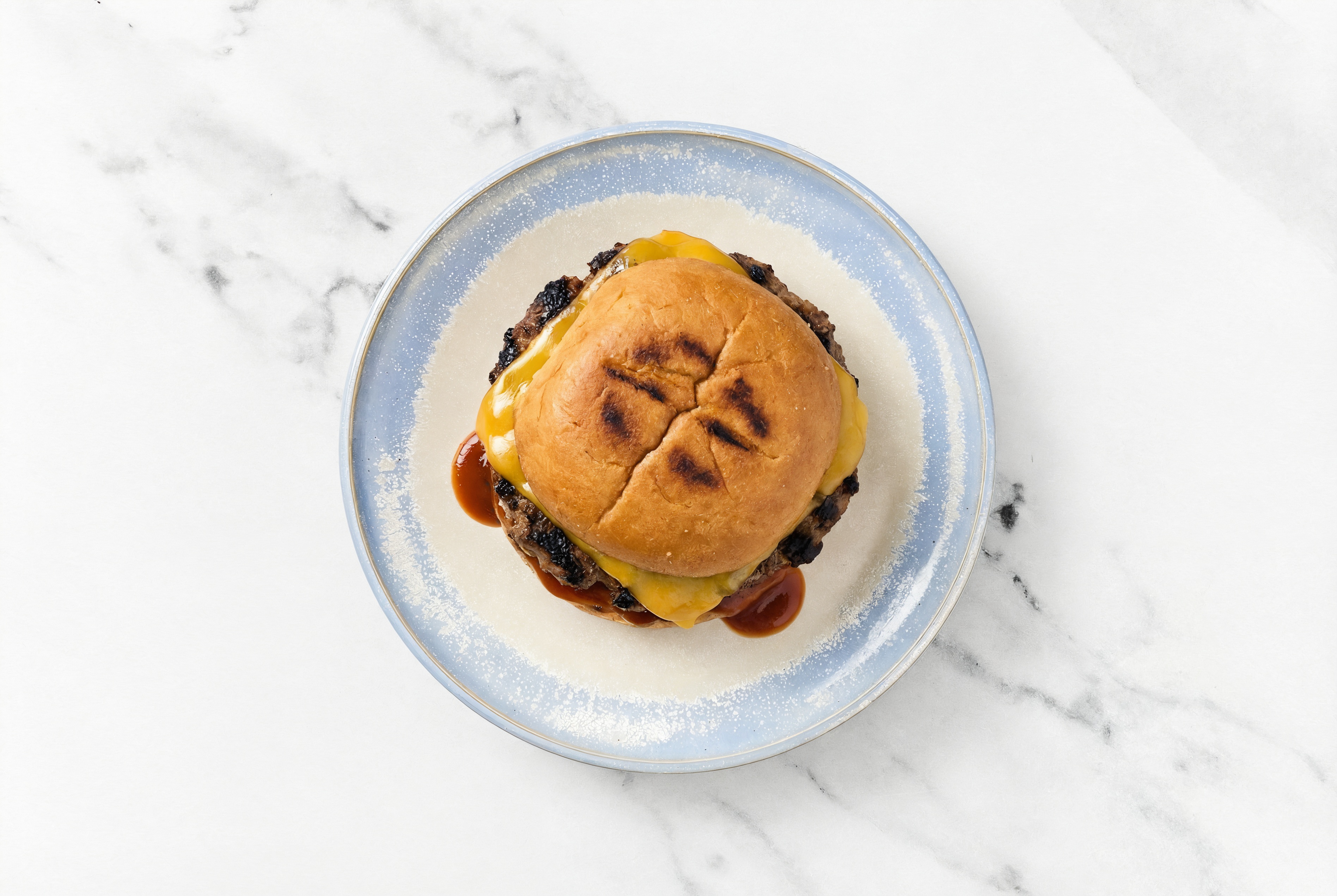 Hearty Grilled BBQ Bison Cheeseburger with Original BBQ