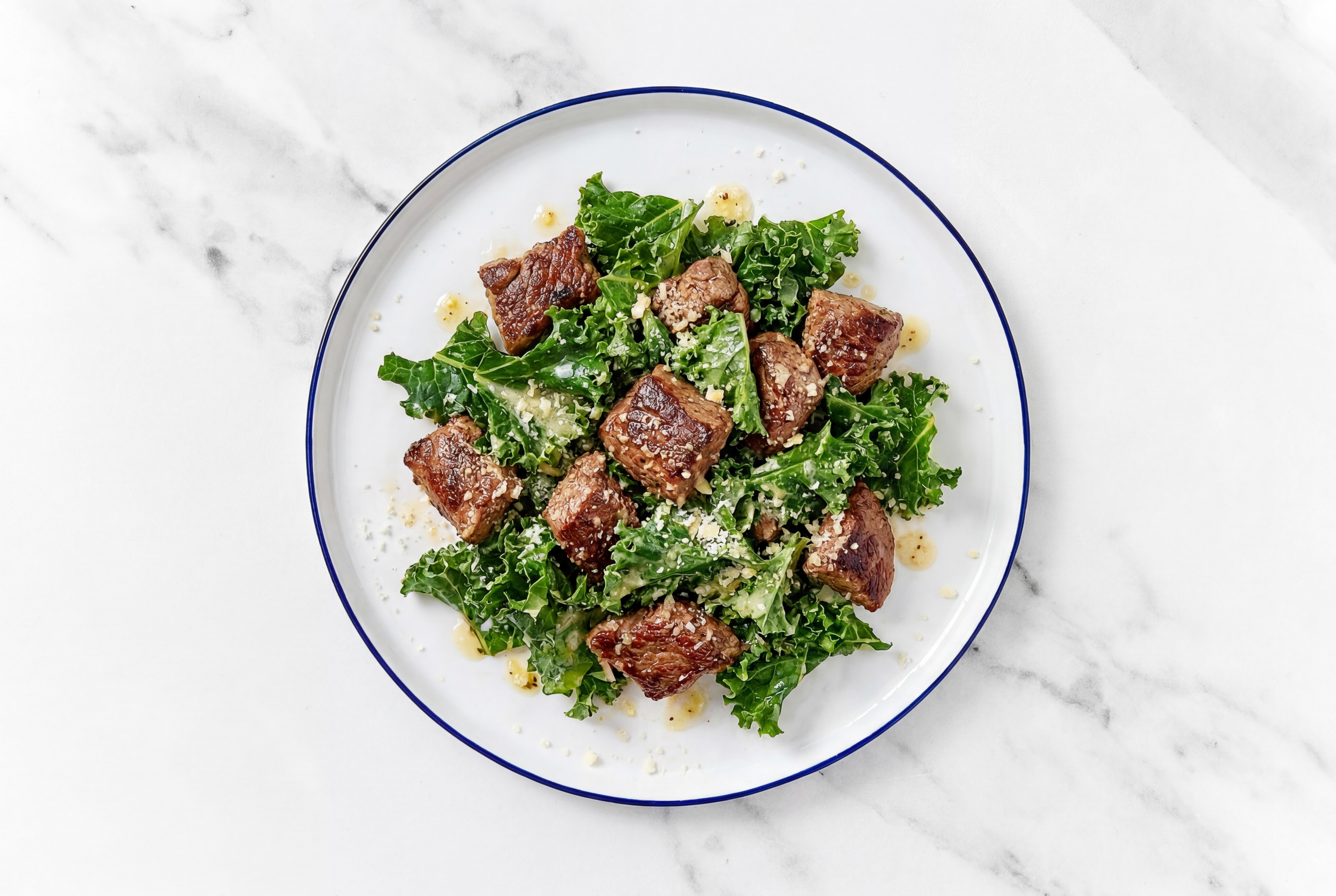 Lemony Lamb Kale Caesar with Grated Parmesan Cheese