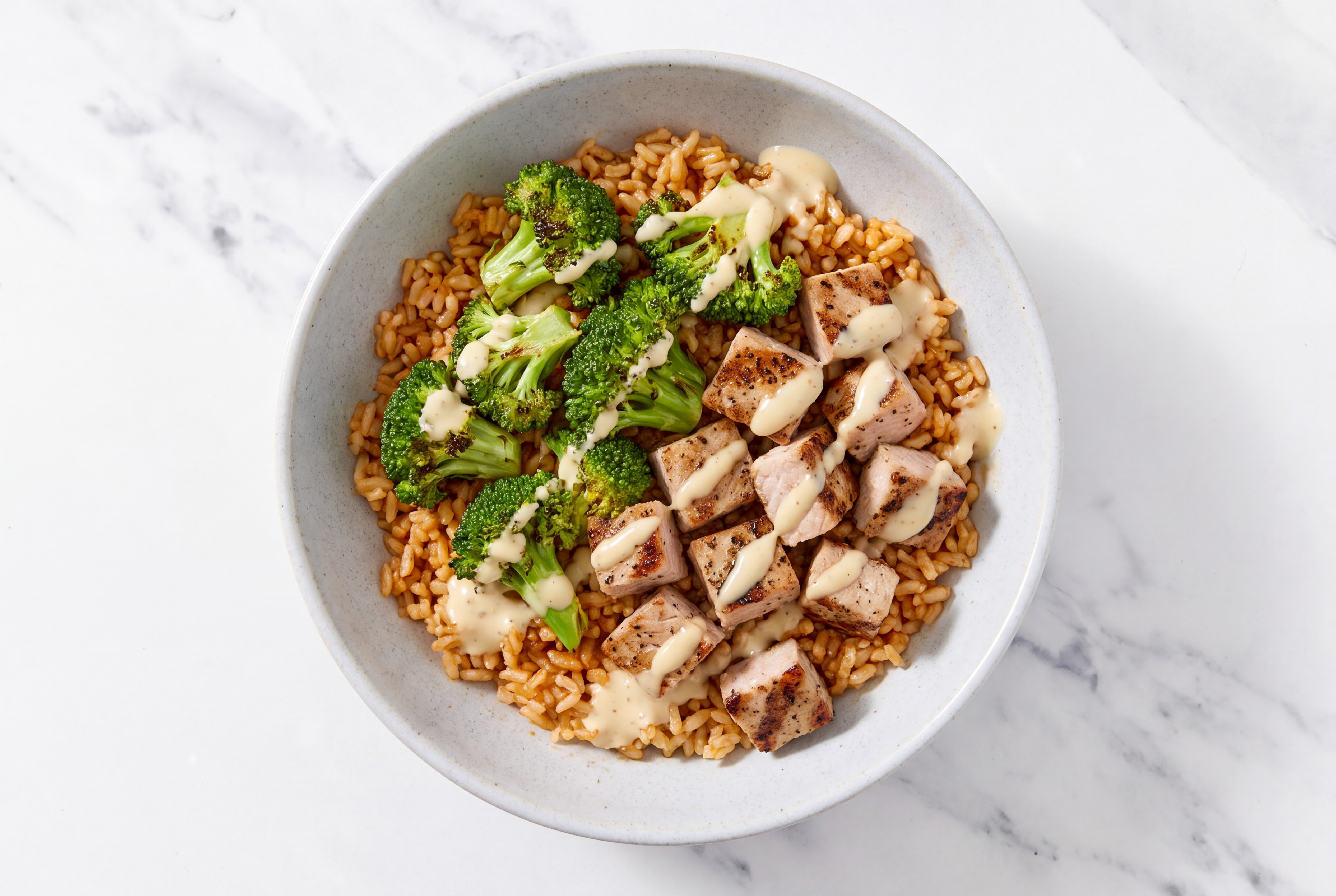 Creamy Pork Chop Brown Rice Bowl with Miso Caesar Dressing & Drizzle