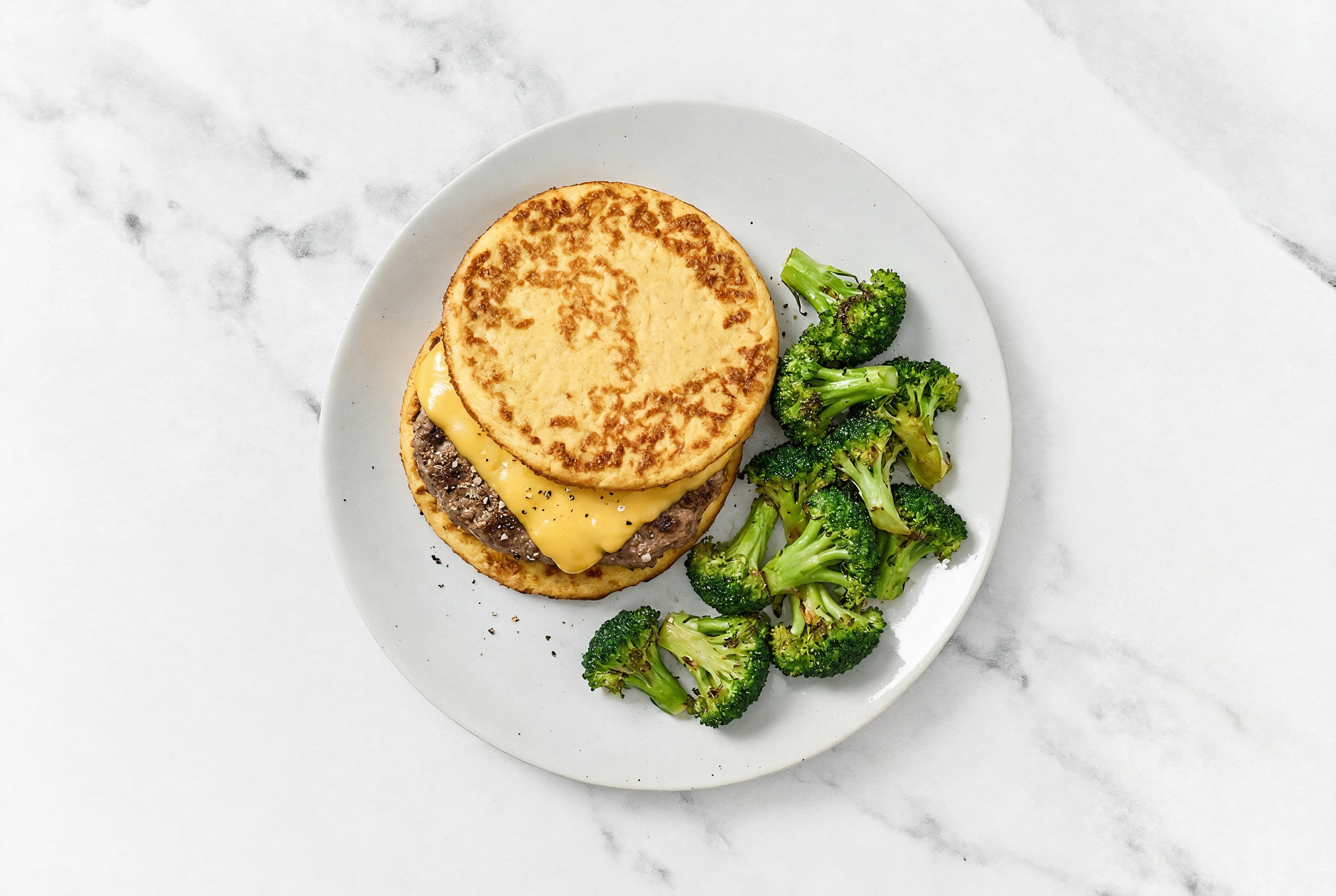 Herby All-American Cheeseburger on Cauli-Bun with Ground Beef Patties