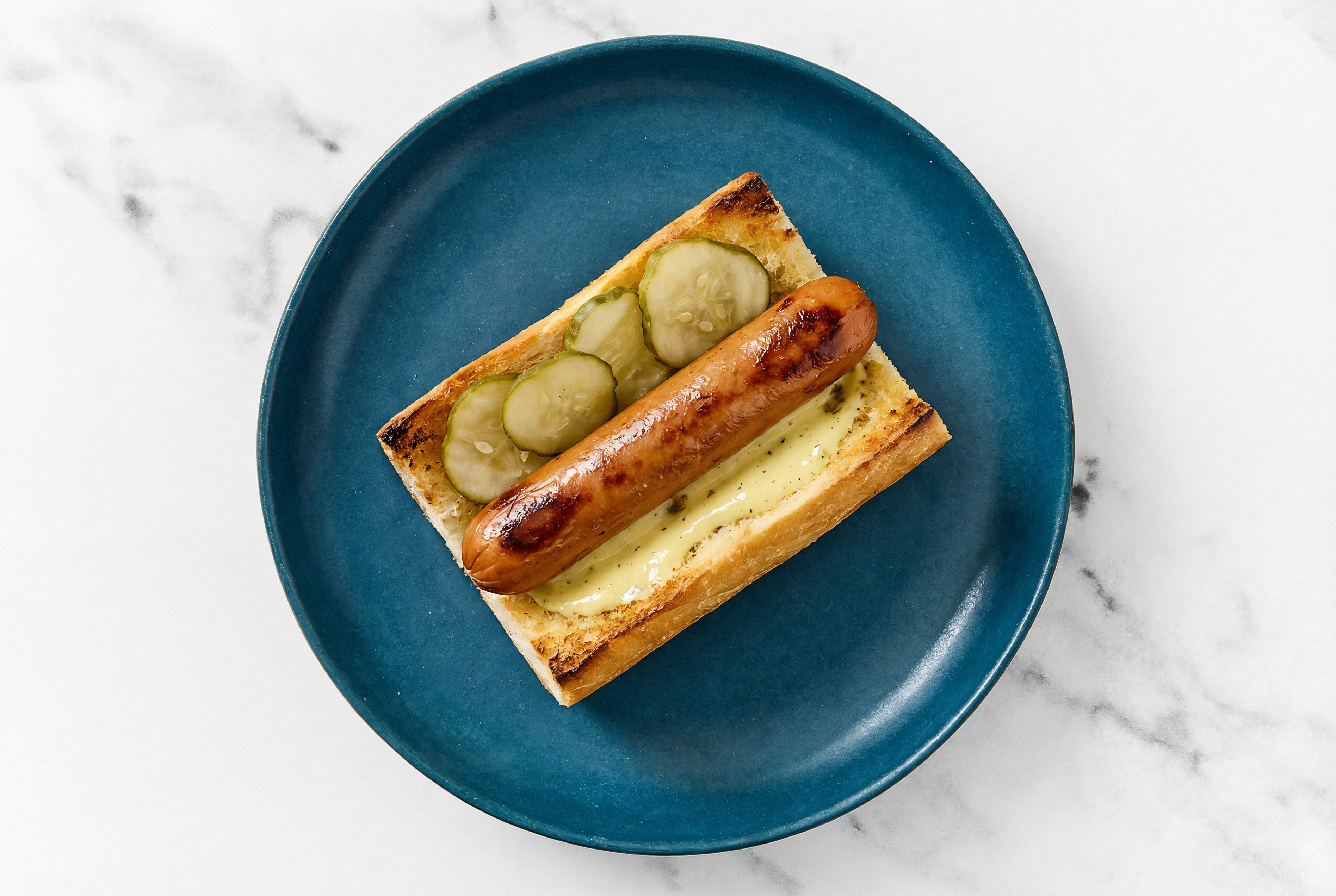 Pickle Smart Dog with Honey Musard Garlic Sauce on Baguette