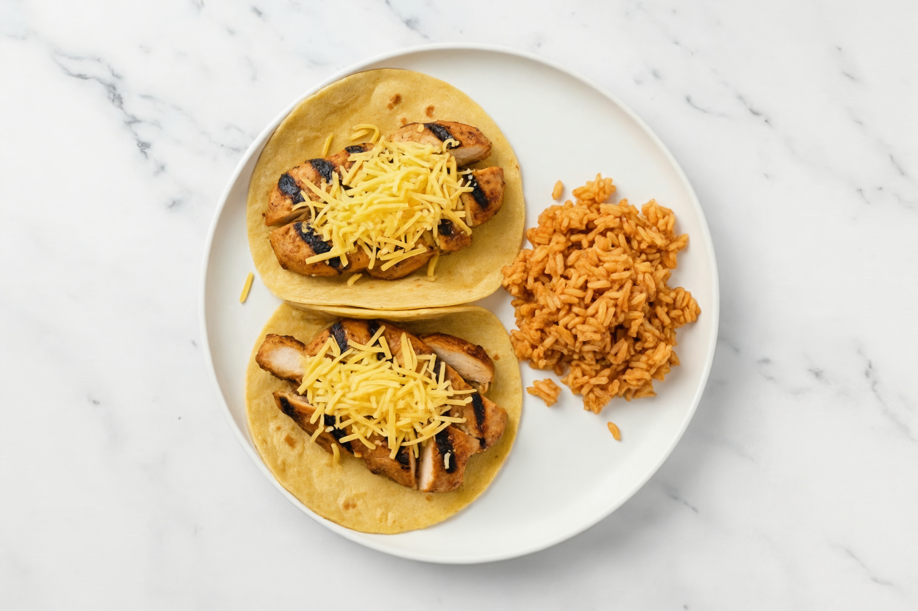 Cheesy Blackened Chicken Tacos + Mexican Rice with Shredded Sharp Cheddar Cheese
