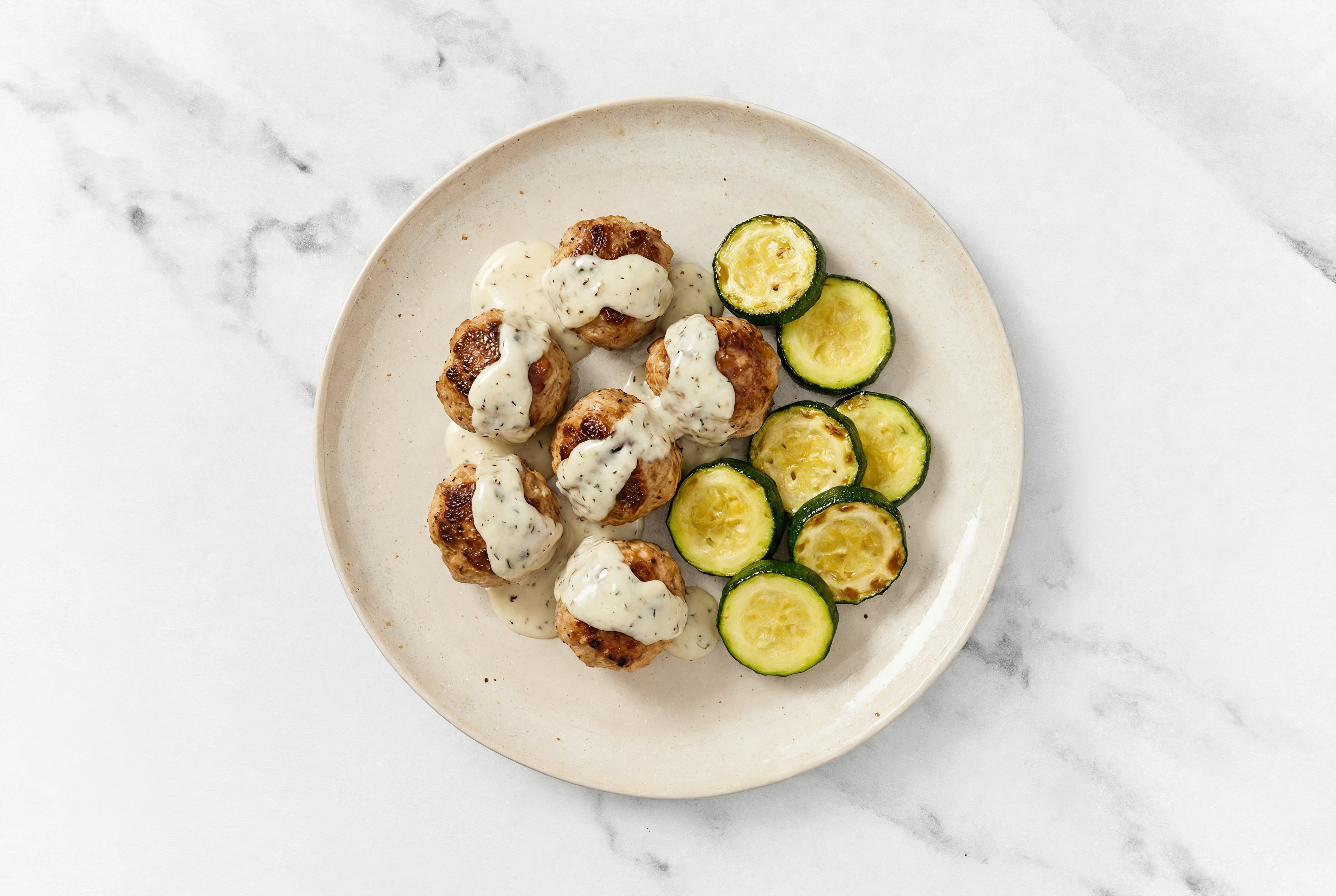 Creamy Garlic Baked Turkey Meatballs & Zucchini | Hungryroot