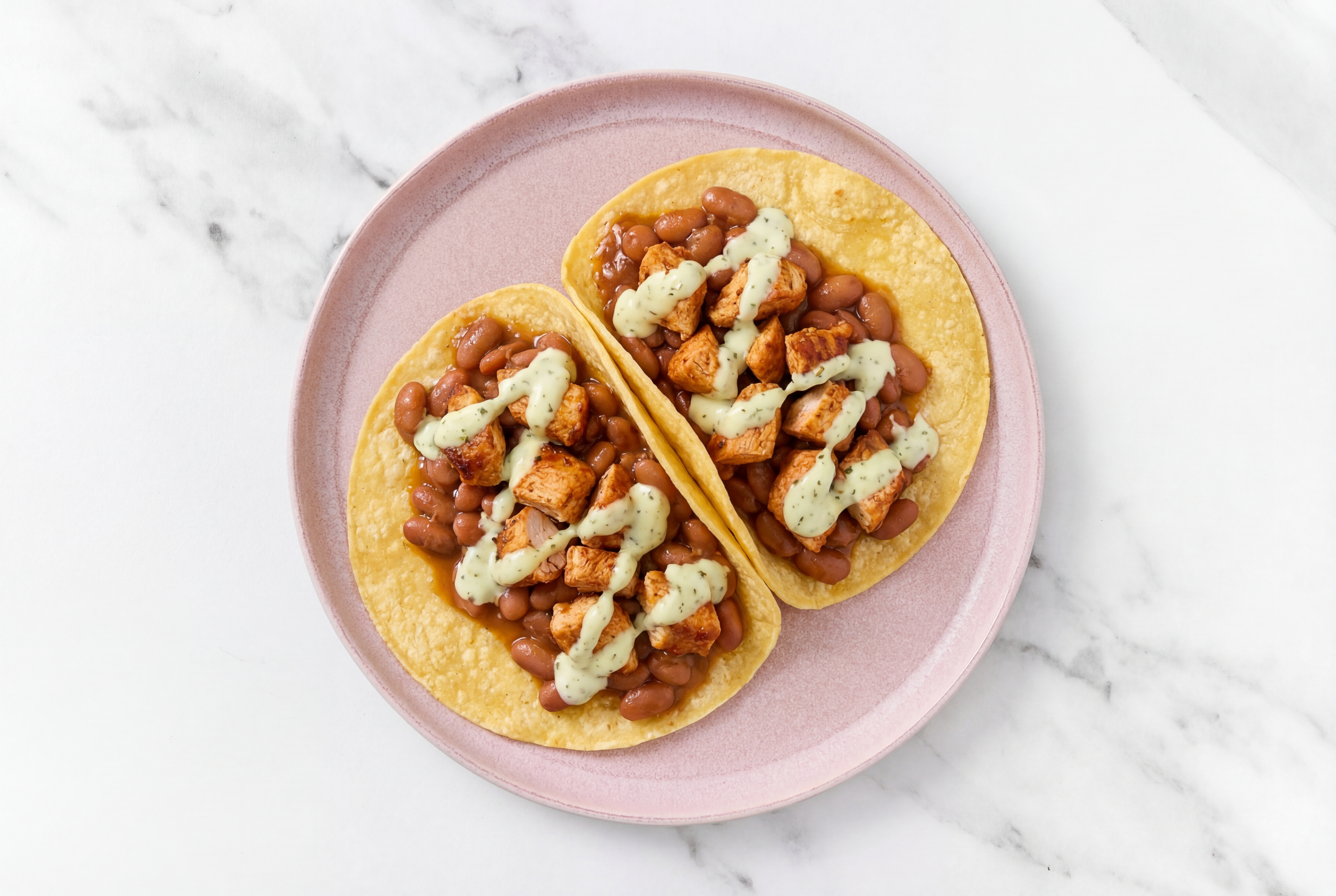 Herby Chipotle Chicken Tacos with Jalapeño Crema & Pinto Beans