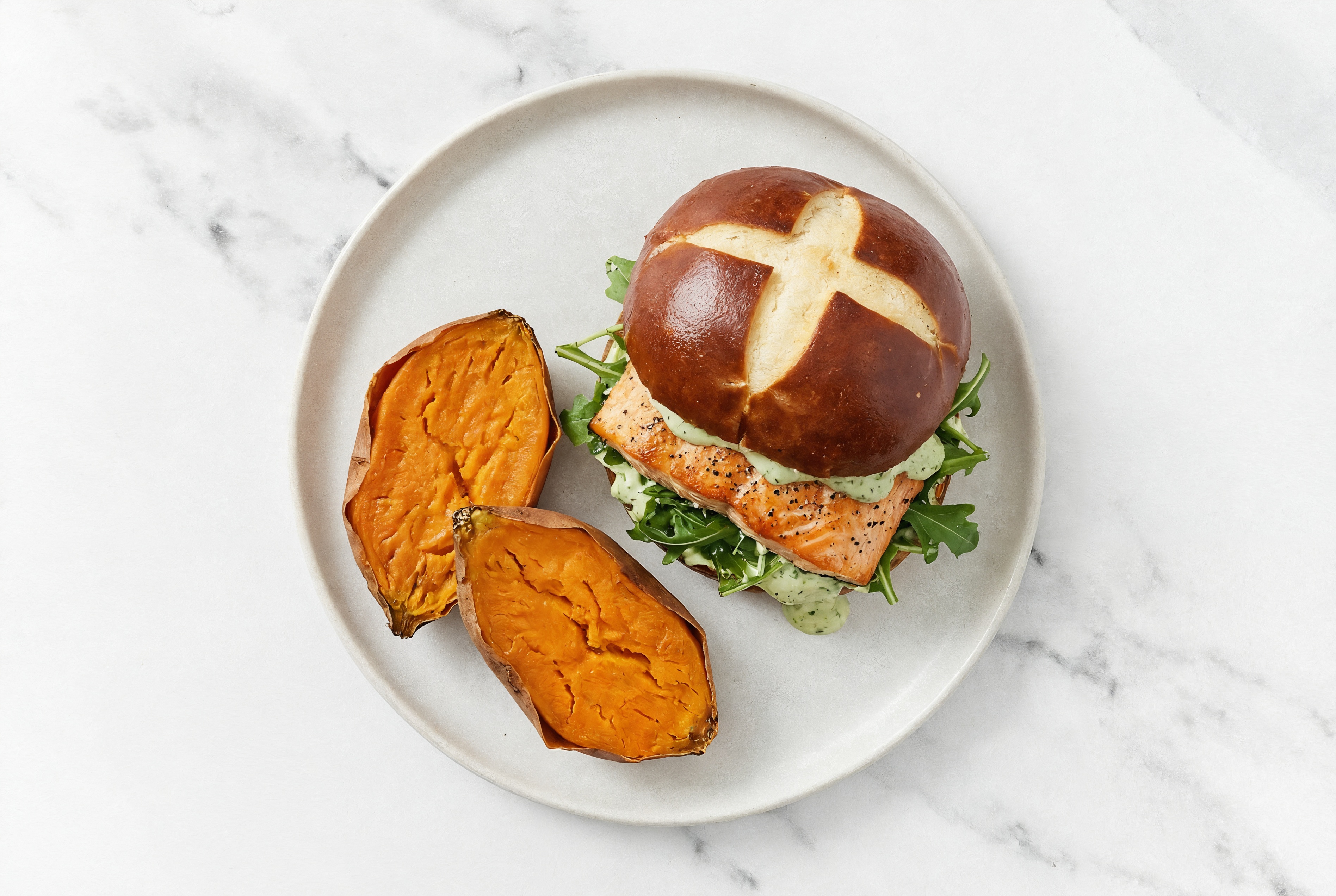 Green Goddess Salmon Sandwich on Pretzel Bun with Arugula + Sweet Potato