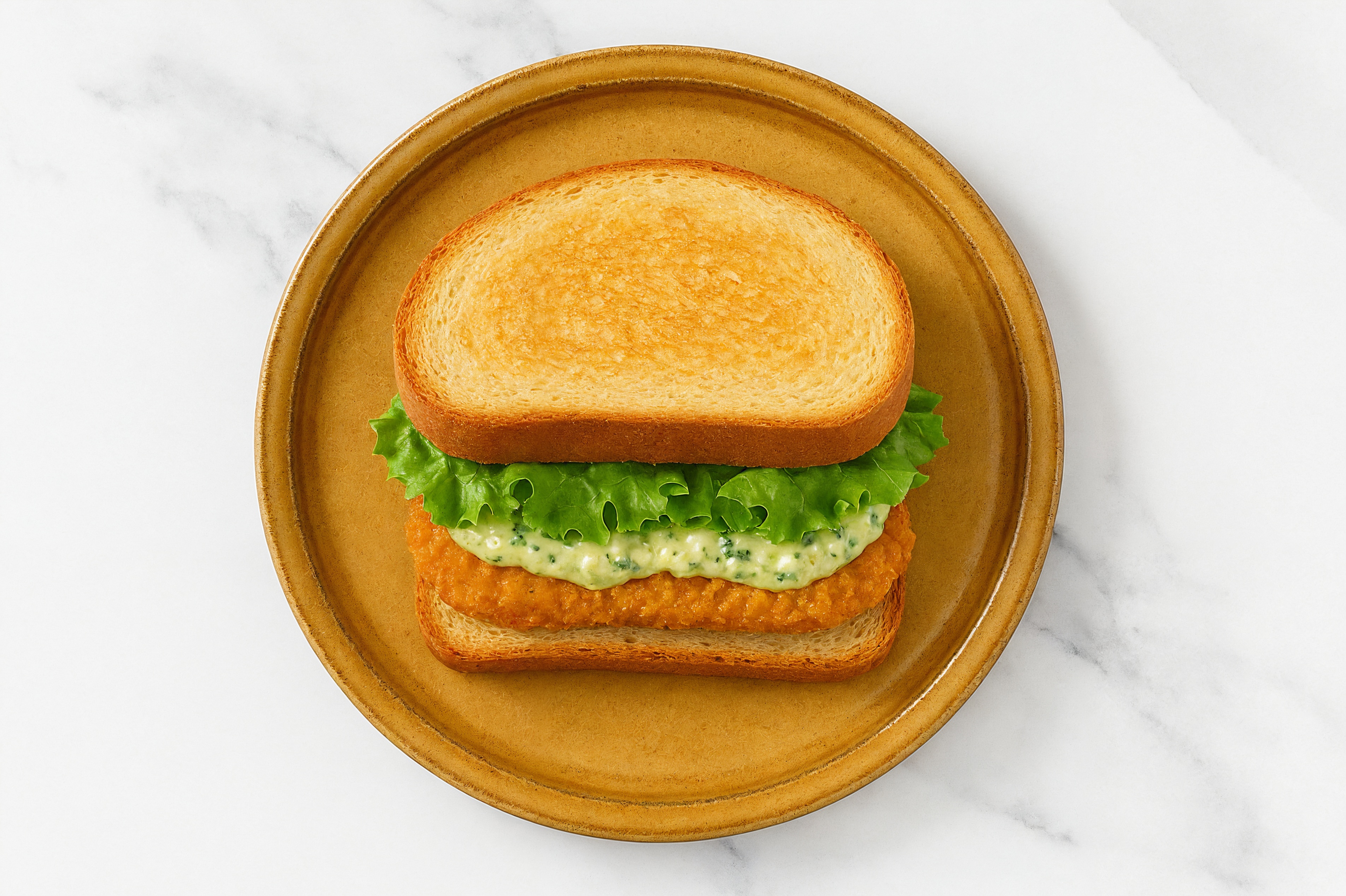 Creamy Artichoke "Chicken" Tenders Sandwich with Green Leaf Lettuce on Honey White Bread