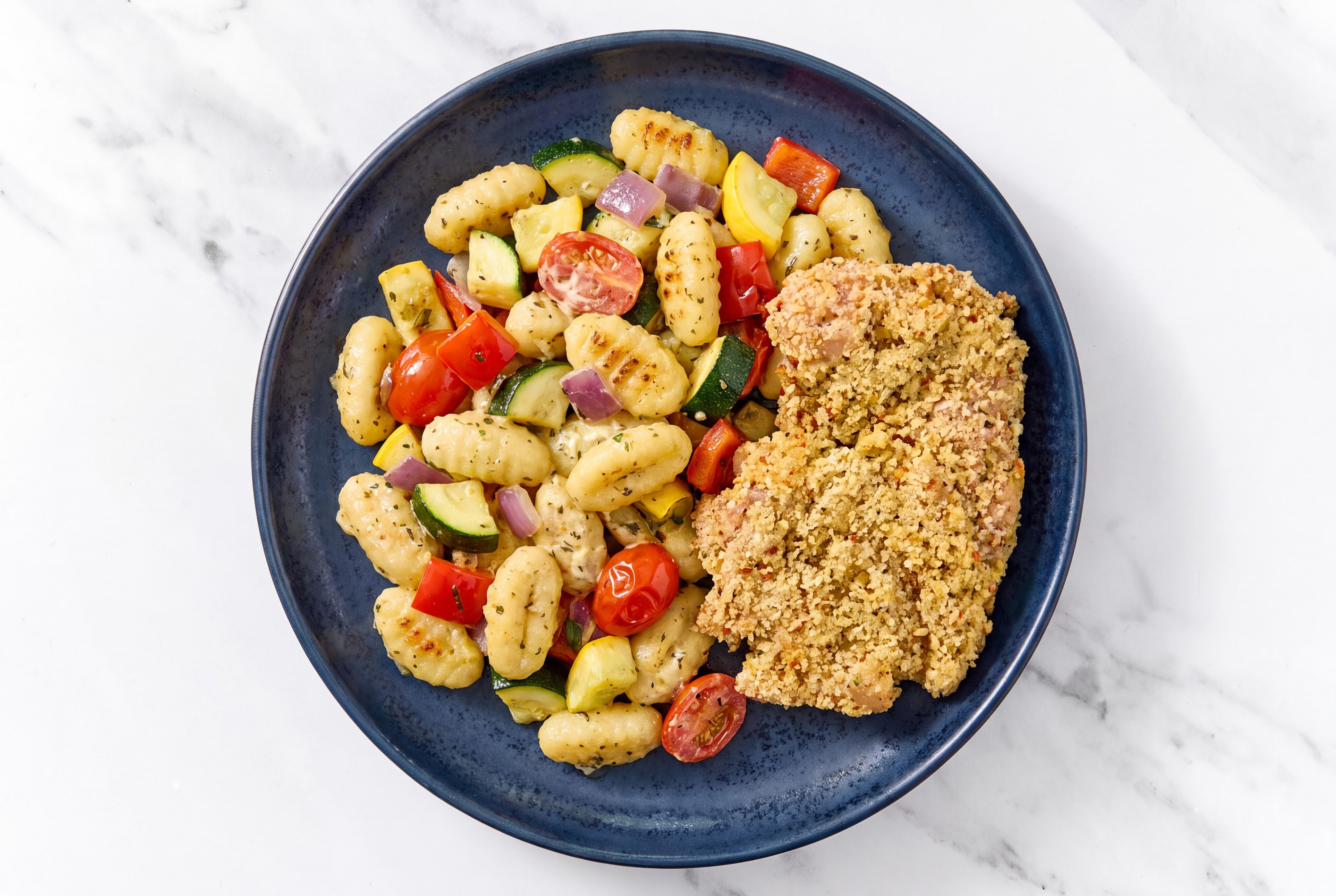 Crispy Garlic Chicken over Creamy Gnocchi with Mixed Veggies